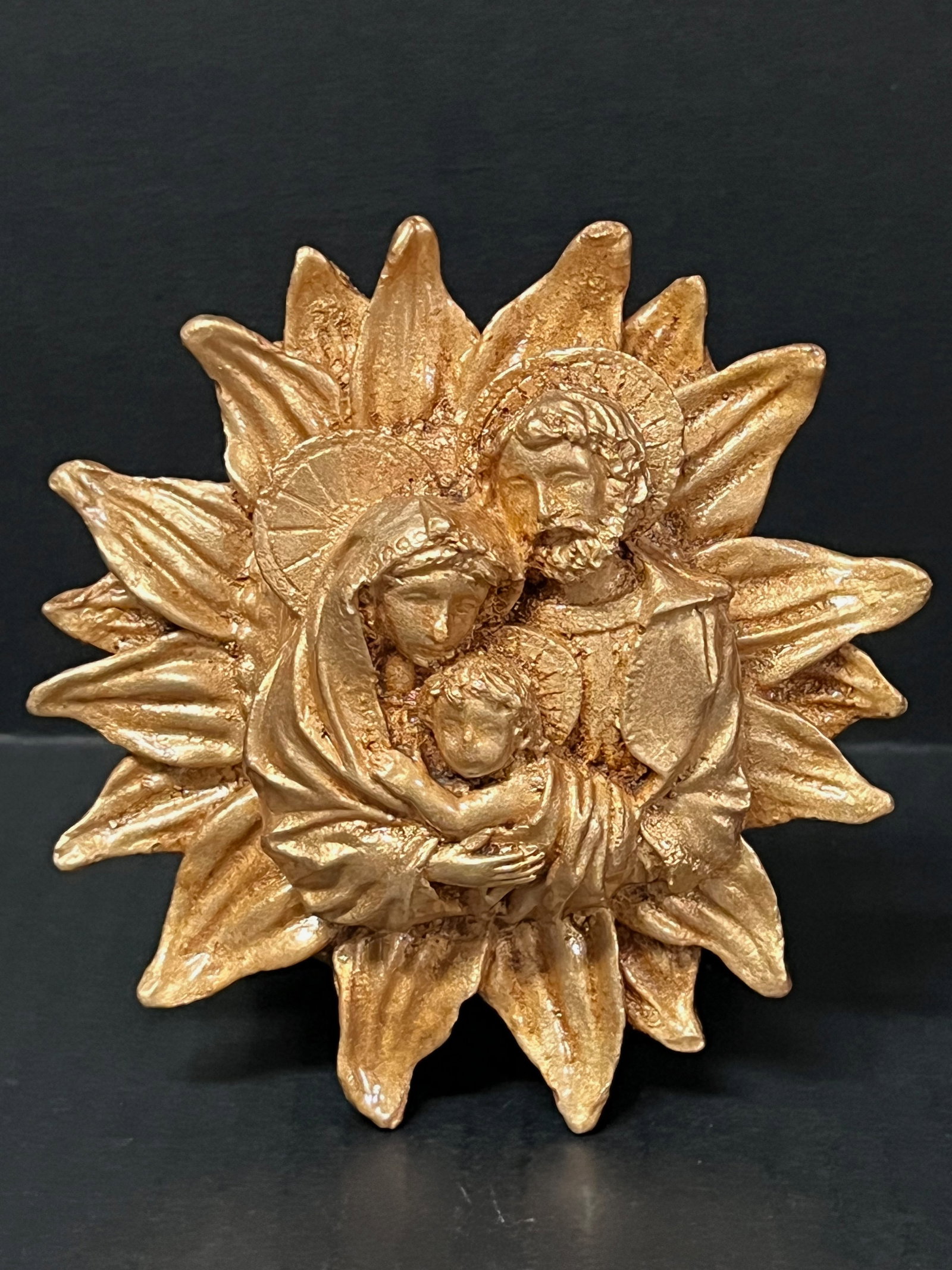 Philippine Cast Mount Pinatubo and Taal Volcano Ash Gold Painted Icon of Holy Family: Religious Art Philippine Cast Mount Pinatubo and Taal Volcano Ash Gold Painted Icon of Holy Family. The dimension is 5 inches high x 1.5 inches depth x 4.5 inches wide. Please be aware that some of th