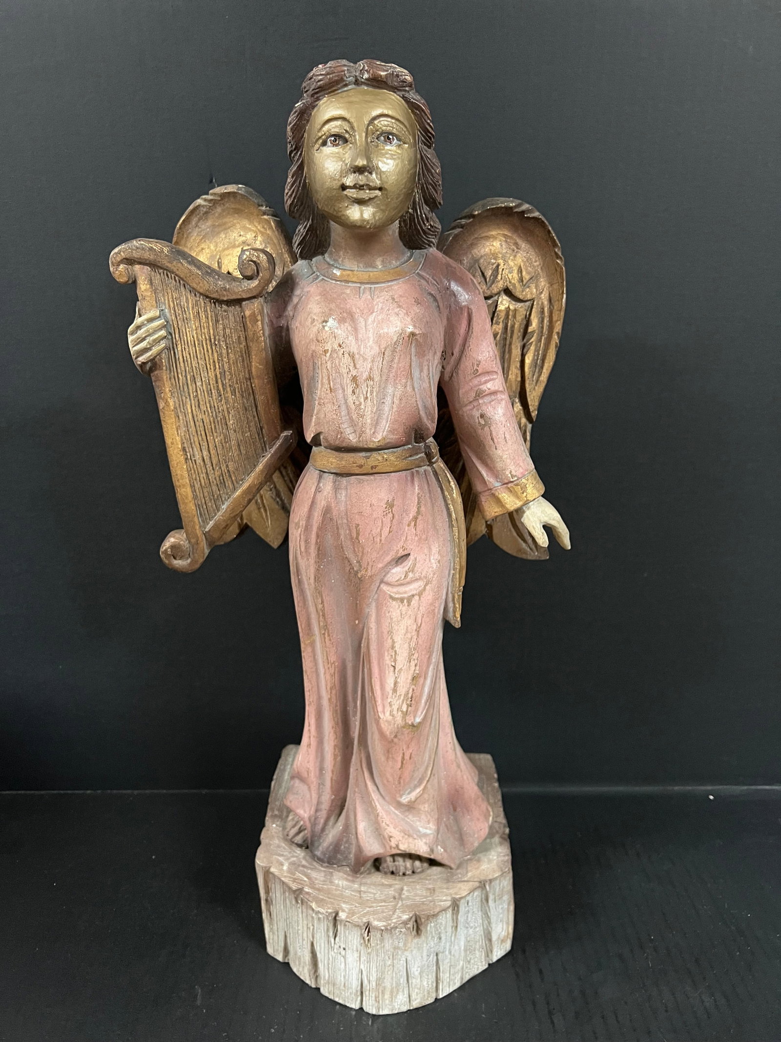 Carved Wood Standing Angel: Religious Art Carved Wood Standing Angel. The dimension is 21 inches high x 7 inches depth x 10 inches wide. Please be aware that some of the items are vintage, secondhand, old ages, antiques and may 