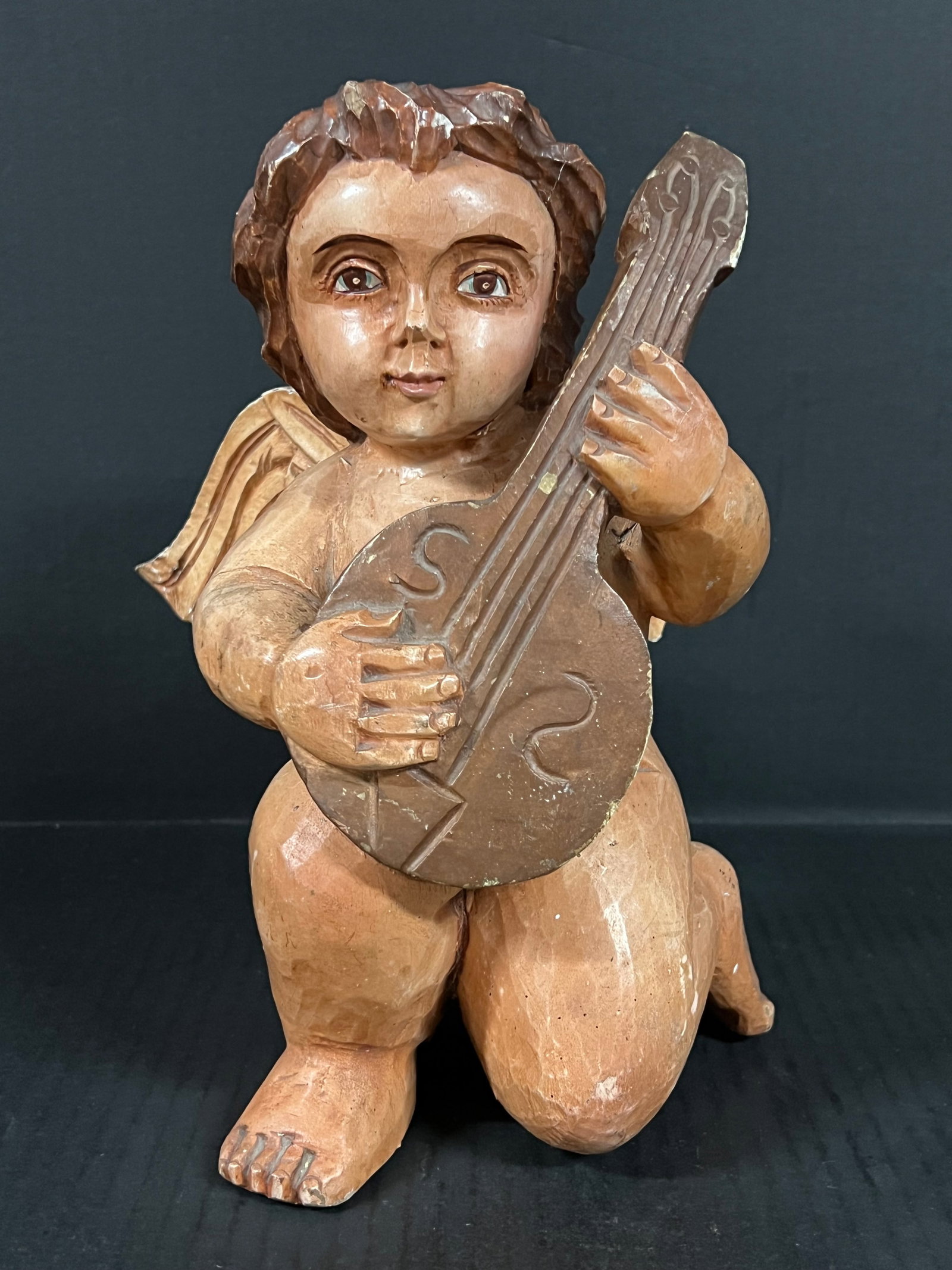 Carved Wood Sitting Angel: Religious Art Carved Wood Sitting Angel. The dimension is 10.5 inches high x 8 inches depth x 8.5 inches wide. Please be aware that some of the items are vintage, secondhand, old ages, antiques and ma
