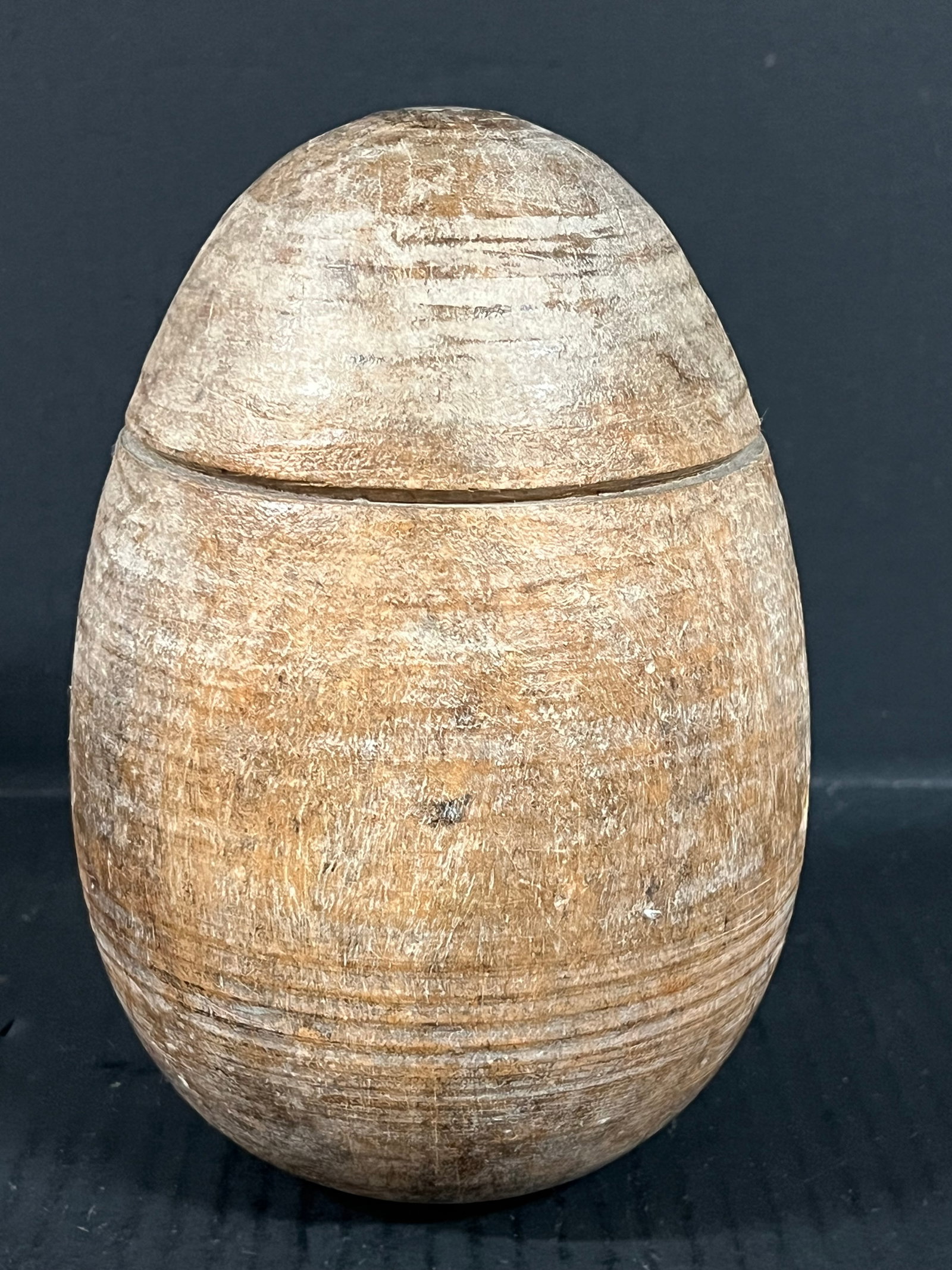 Carved Wood Large Egg: Folk Art Carved Wood Large Egg. The dimension is 8 inches high x 5.5 inches depth x 5.5 inches wide. Please be aware that some of the items are vintage, secondhand, old ages, antiques and may have a d