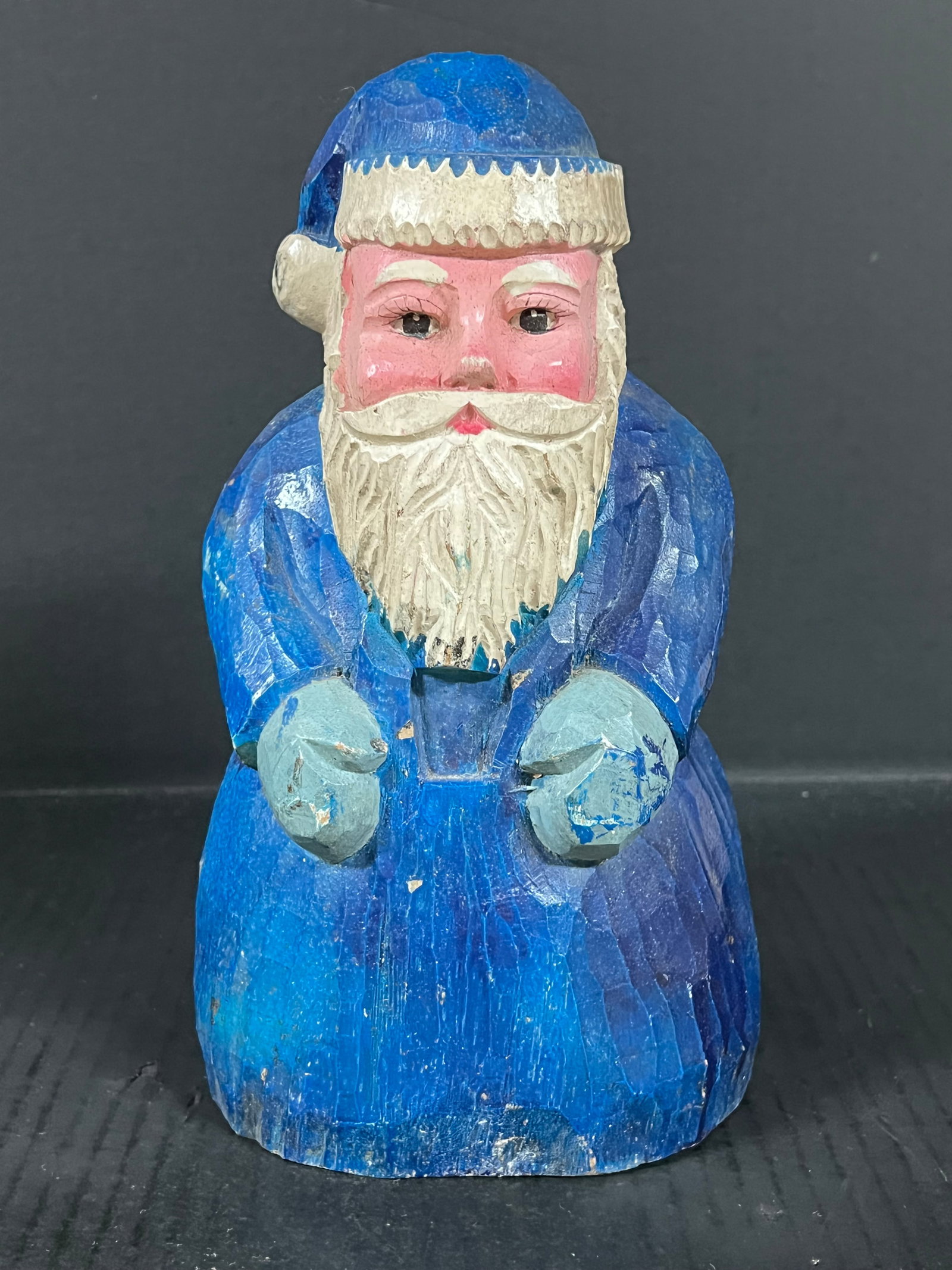 Carved Wood Santa Claus: Folk Art Carved Wood Santa Claus. The dimension is 10.25 inches high x 5.5 inches depth x 5.75 inches wide. Please be aware that some of the items are vintage, secondhand, old ages, antiques and may