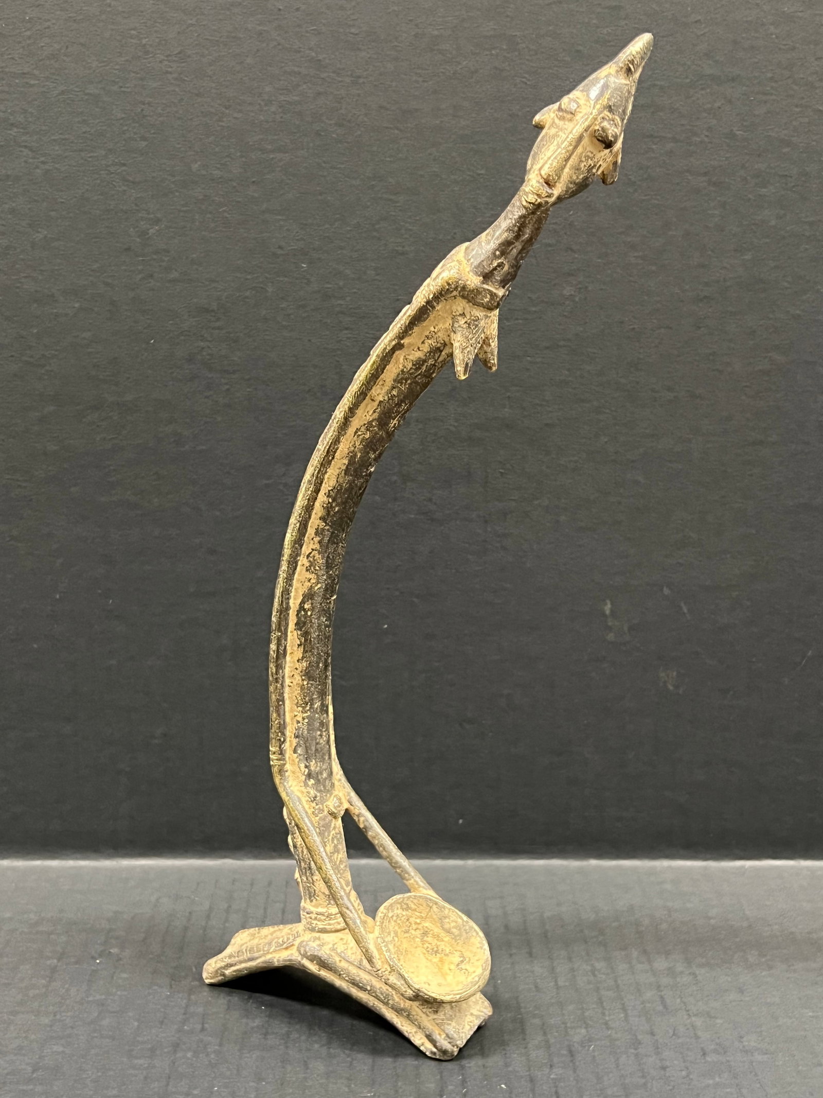 Bronze Dogon Statue: African Tribal Art Bronze Dogon Statue. The dimension is 14 inches high x 4.5 inches wide. Please be aware that some of the items are vintage, secondhand, old ages, antiques and may have a defects or 