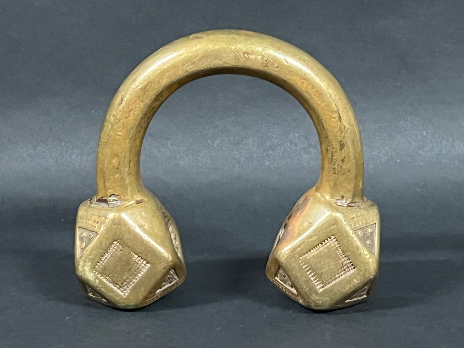 Nigerian Bronze Currency Bracelet Tuareg: African Tribal Art Nigerian Bronze Currency Bracelet Tuareg. The dimension is 4.5 inches high x 5 inches wide. Please be aware that some of the items are vintage, secondhand, old ages, antiques and