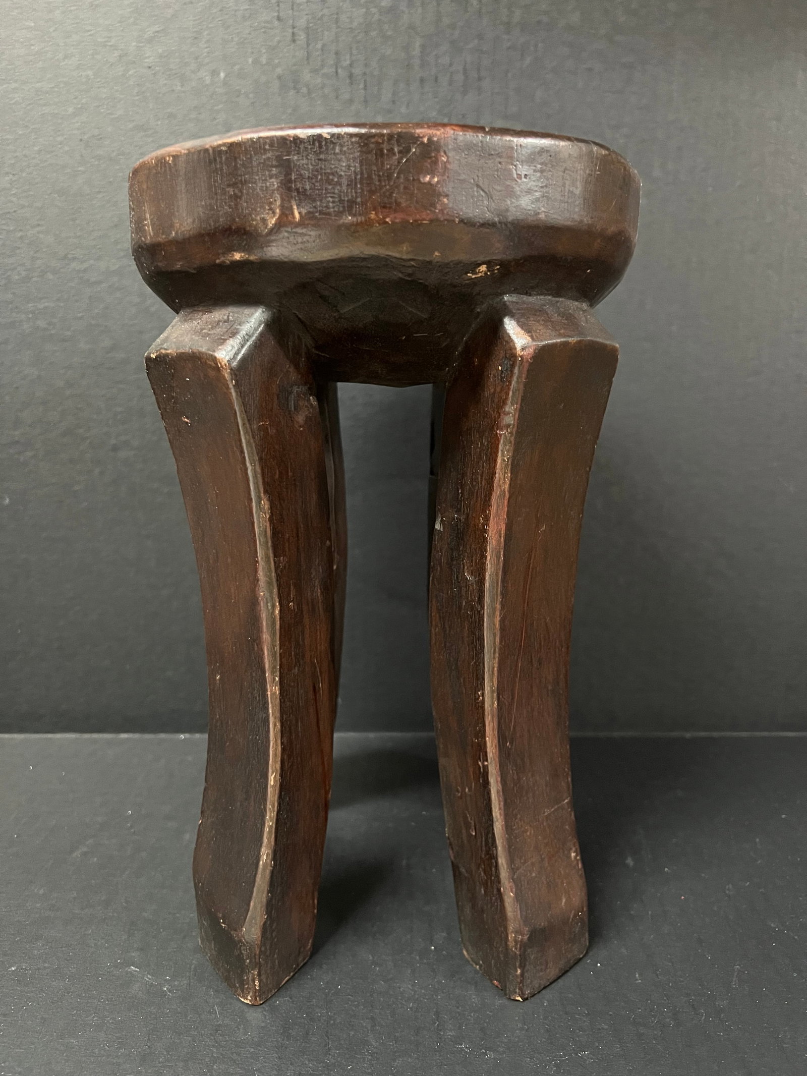 Carved Wood Tanzania Stool: African Tribal Art Carved Wood Tanzania Stool. The dimension is 12.5 inches high x 8.5 inches wide. Please be aware that some of the items are vintage, secondhand, old ages, antiques and may have a