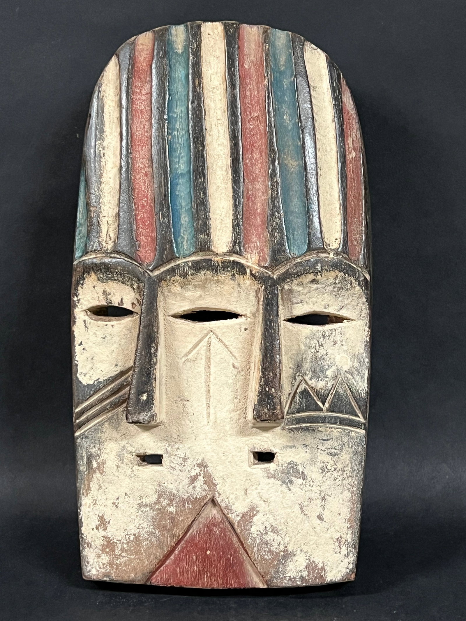 Carved Wood Vuvi Mask: African Tribal Art Carved Wood Vuvi Mask. The dimension is 11 inches high x 6 inches wide. Please be aware that some of the items are vintage, secondhand, old ages, antiques and may have a defects or 