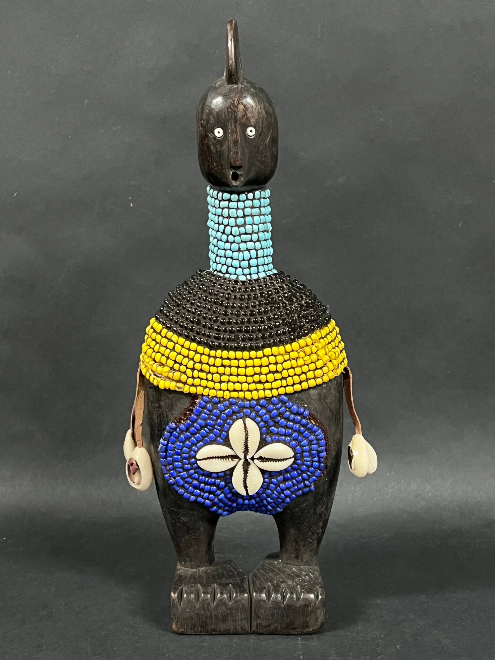 Carved Wood Namji Doll: African Tribal Art Carved Wood Namji Doll. The dimension is 12.25 inches high x 4.25 inches wide. Please be aware that some of the items are vintage, secondhand, old ages, antiques and may have a defe