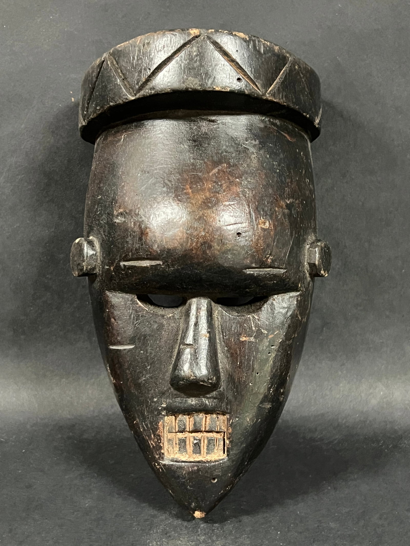 Carved Wood Salampaso Mask: African Tribal Art Carved Wood Salampaso Mask. The dimension is 10.25 inches high x 6 inches wide. Please be aware that some of the items are vintage, secondhand, old ages, antiques and may have a def