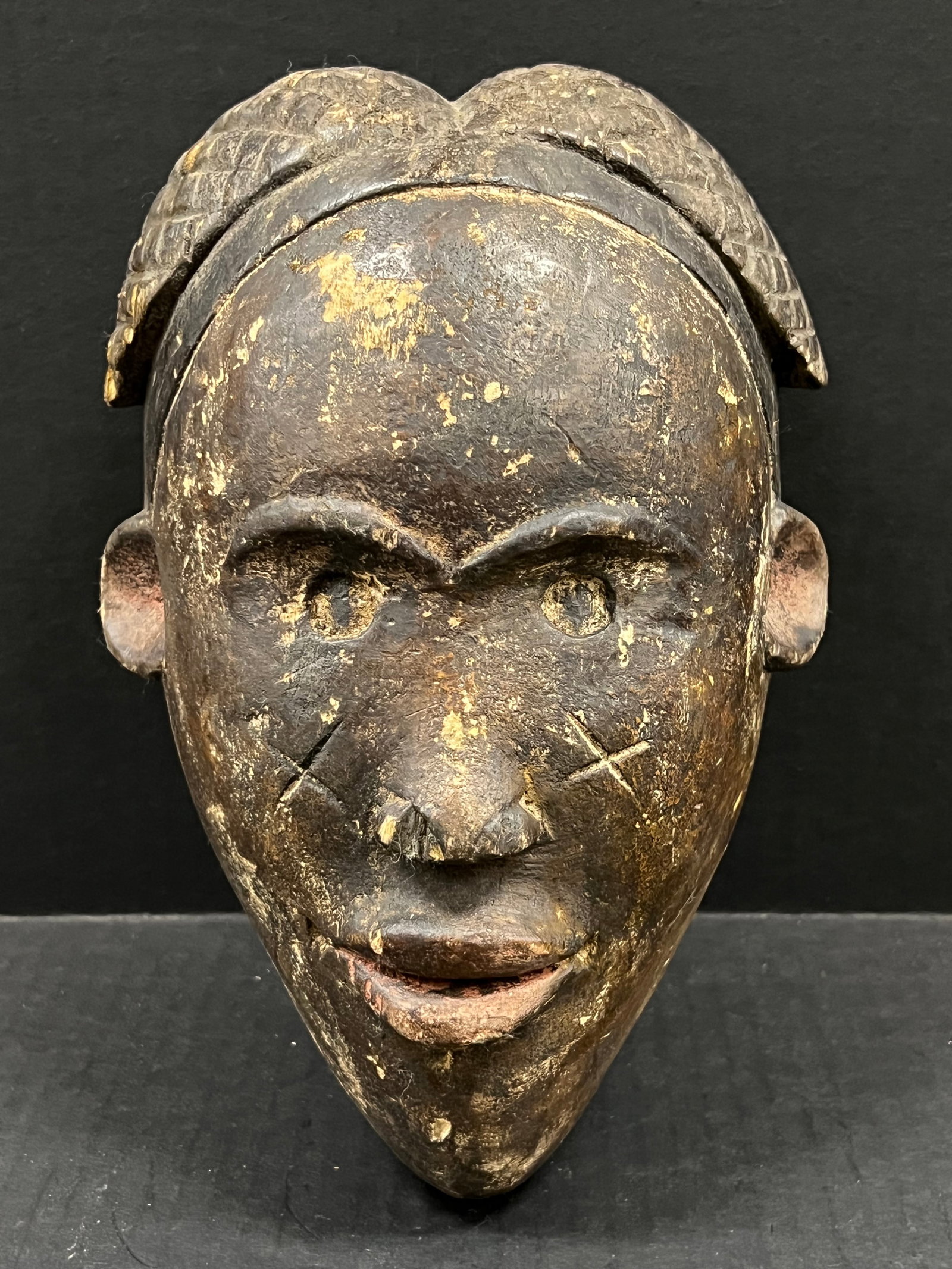 Carved Wood Lumbo Mask: African Tribal Art Carved Wood Lumbo Mask. The dimension is 10 inches high x 7 inches wide. Please be aware that some of the items are vintage, secondhand, old ages, antiques and may have a defects