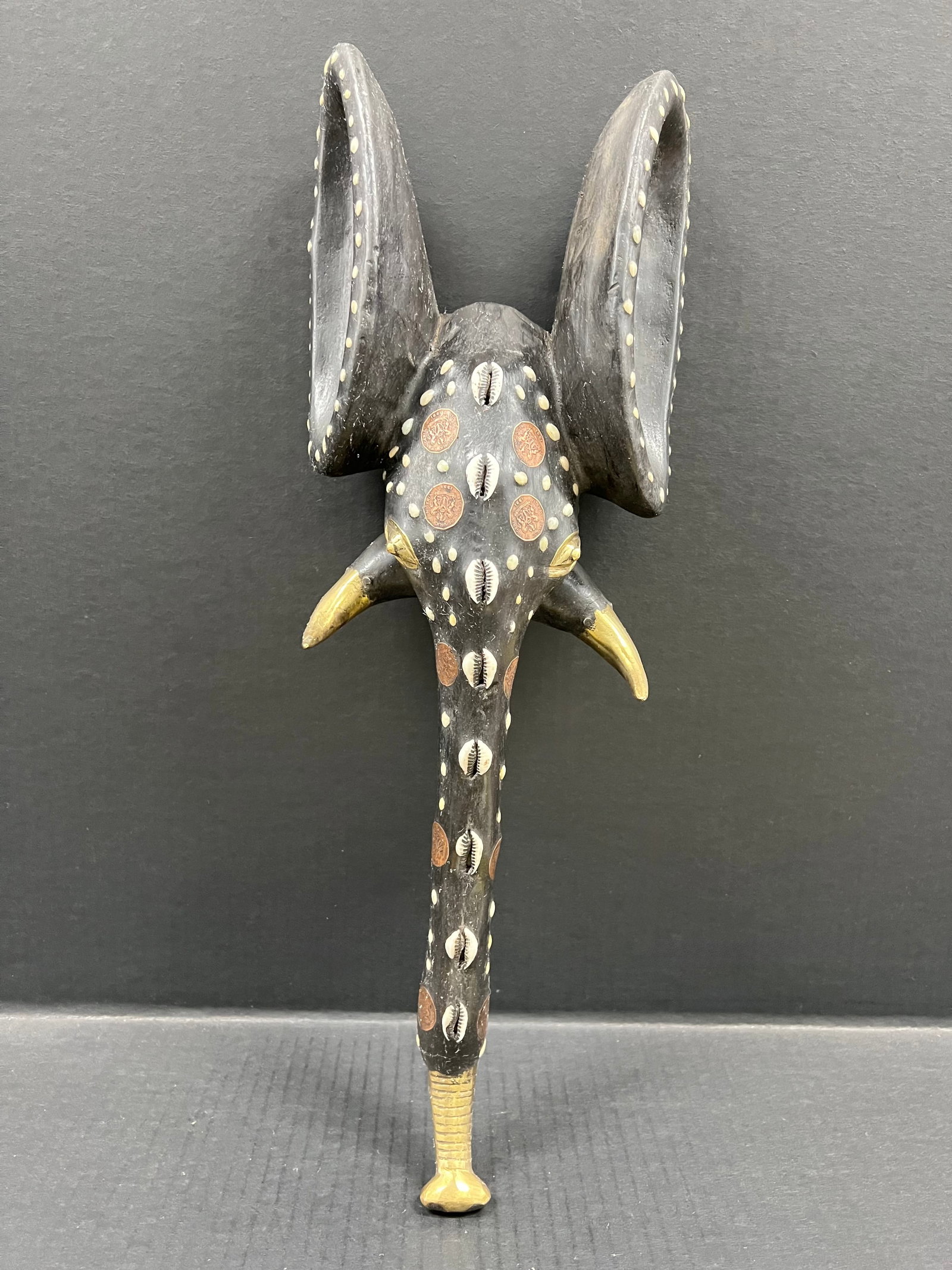 Carved Wood Elephant Mask: African Tribal Art Carved Wood Elephant Mask. The dimension is 20 inches high x 7 inches wide. Please be aware that some of the items are vintage, secondhand, old ages, antiques and may have a defects