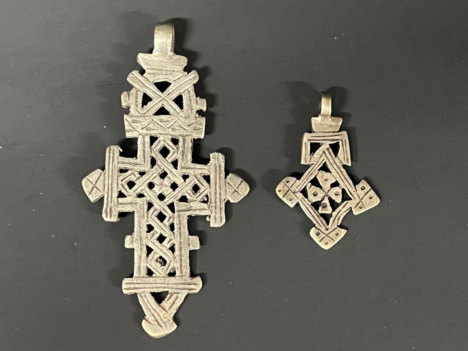 Ethiopian Metal Coptic Cross Pendant 2 Pcs.: African Tribal Art Ethiopian Metal Coptic Cross Pendant 2 Pcs. The dimension is 3.25 inches high x 2.25 inches wide. Please be aware that some of the items are vintage, secondhand, old ages, antiques 