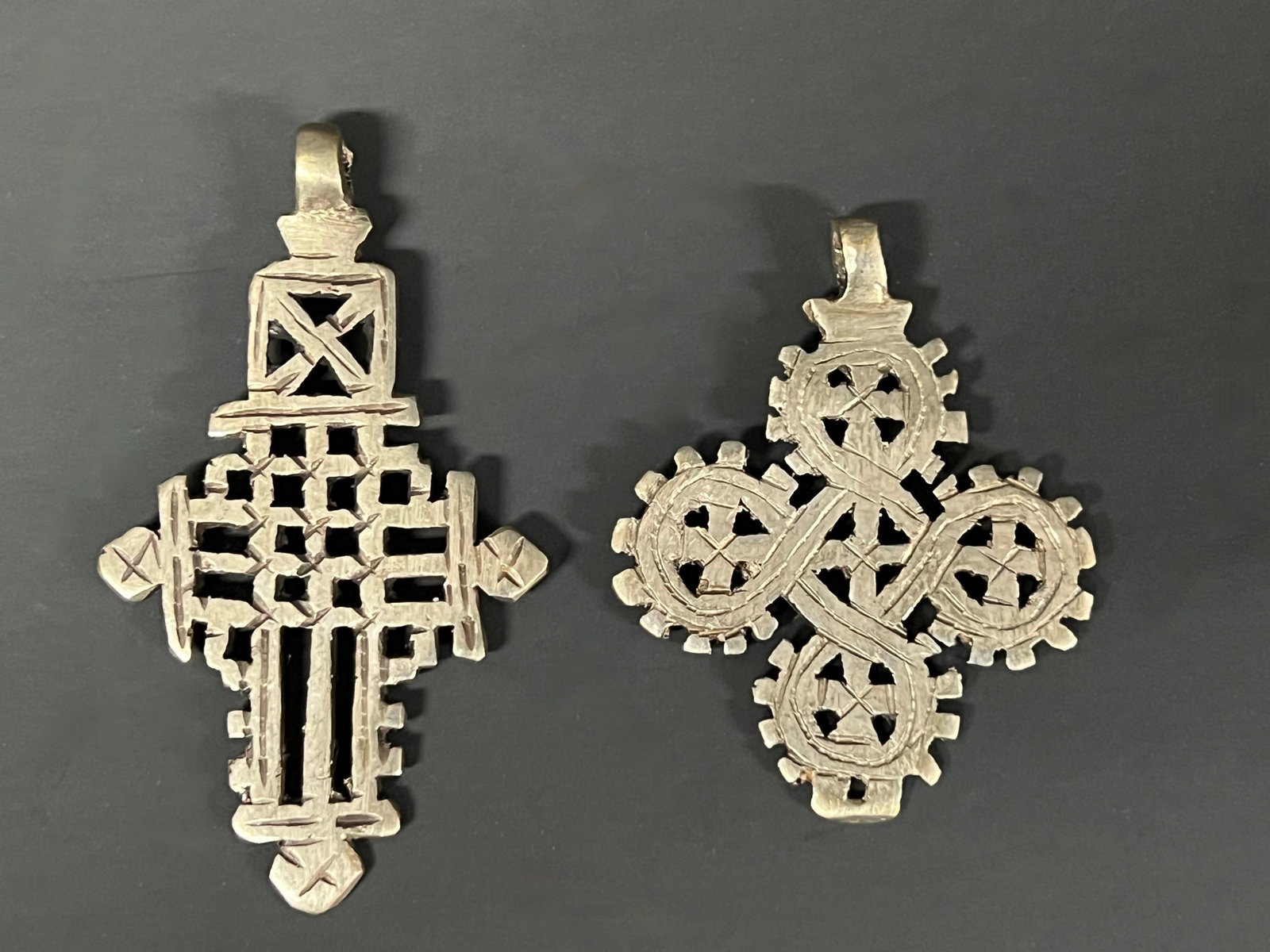Ethiopian Metal Coptic Cross Pendant 2 Pcs.: African Tribal Art Ethiopian Metal Coptic Cross Pendant 2 Pcs. The dimension is 3.25 inches high x 2.25 inches wide. Please be aware that some of the items are vintage, secondhand, old ages, antiques 