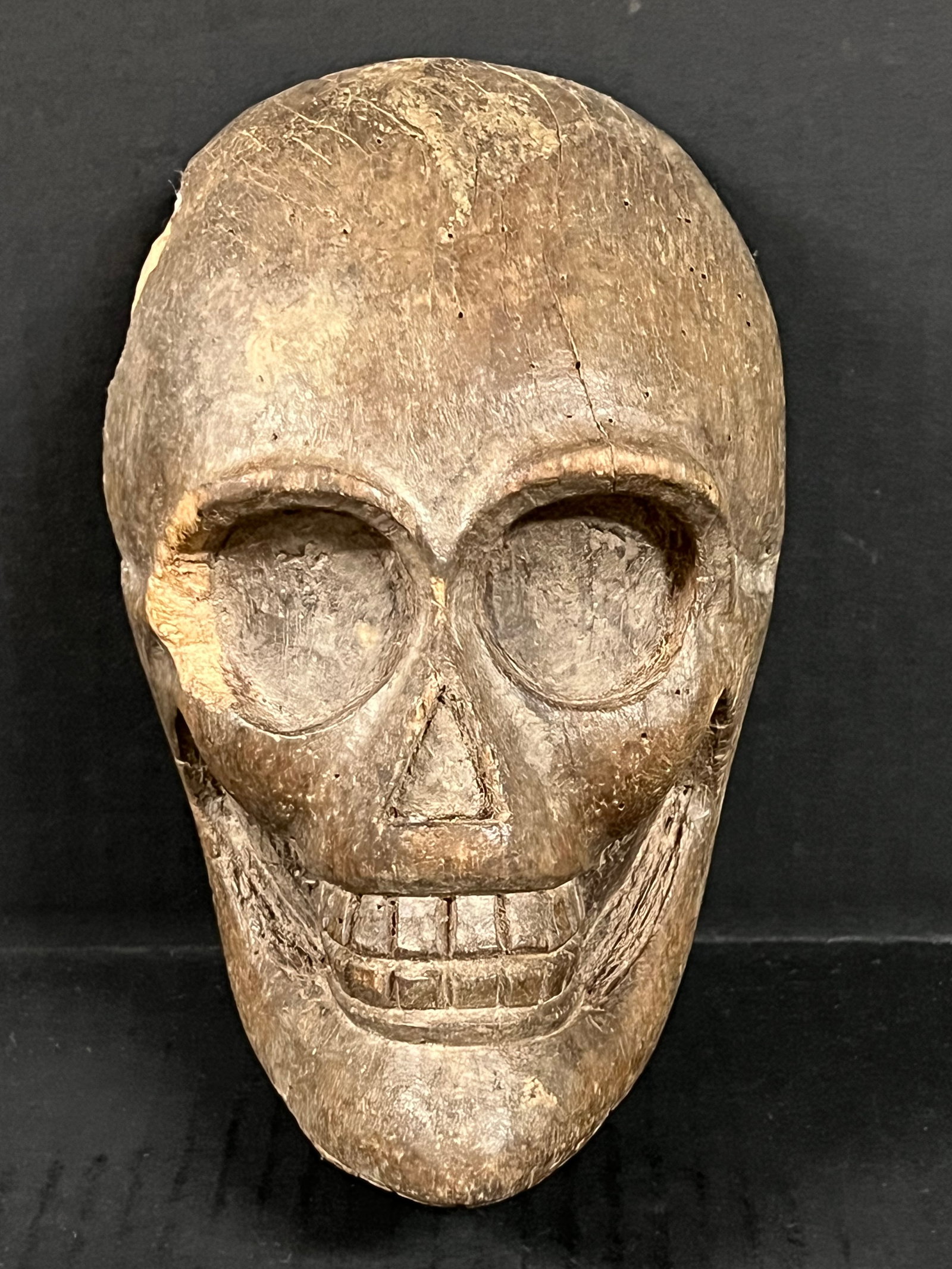 Carved Wood Skull Face Plaque: Folk Art Carved Wood Skull Face Plaque. The dimension is 8 inches high x 5.25 inches wide. Please be aware that some of the items are vintage, secondhand, old ages, antiques and may have a defects or 