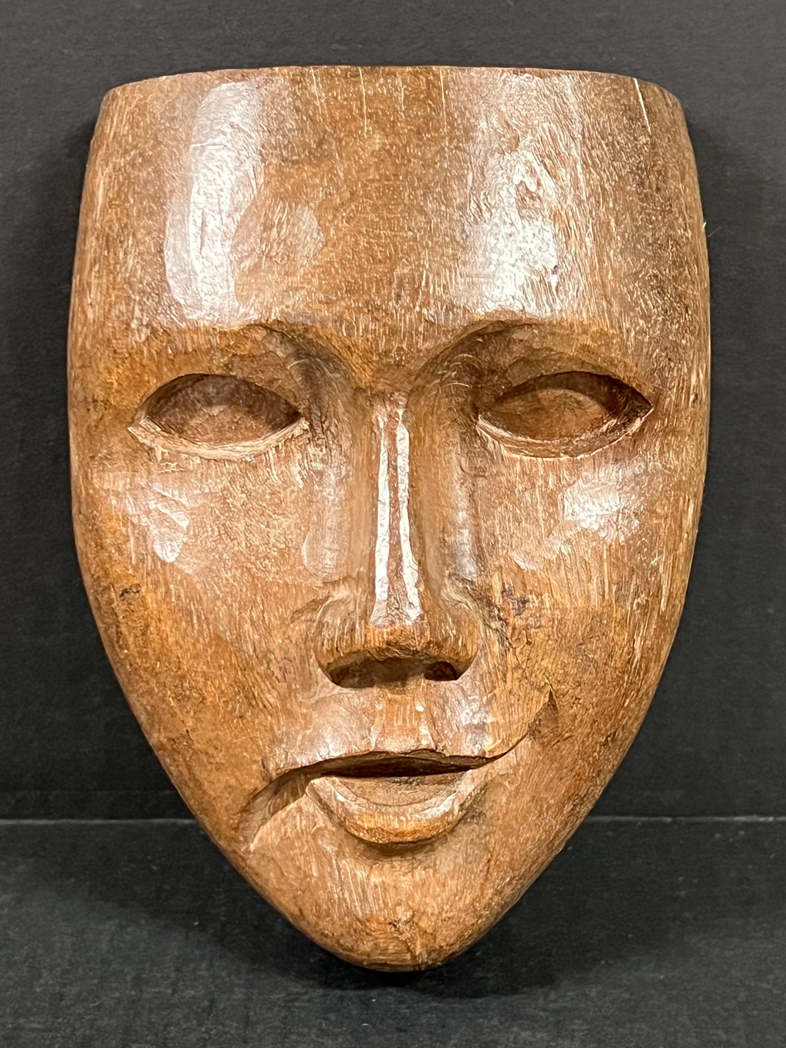 Carved Wood Male Face Plaque: Folk Art Carved Wood Male Face Plaque. The dimension is 7.5 inches high x 5.5 inches wide. Please be aware that some of the items are vintage, secondhand, old ages, antiques and may have a defects or