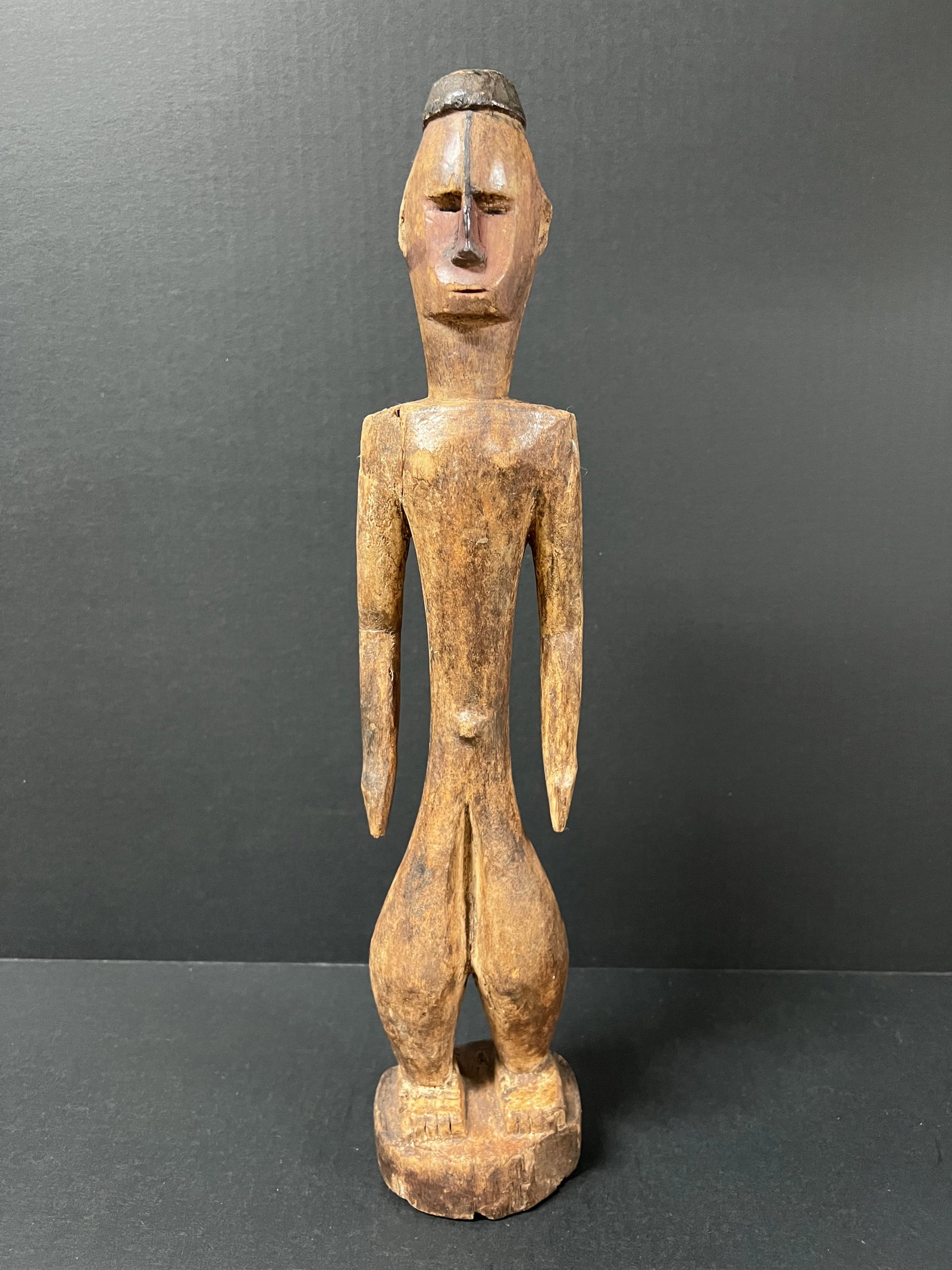 Carved Wood Tanzania Statue: African Tribal Art Carved Wood Tanzania Statue. The dimension is 17.75 inches high x 3.5 inches depth x 7 inches wide. Please be aware that some of the items are vintage, secondhand, old ages,