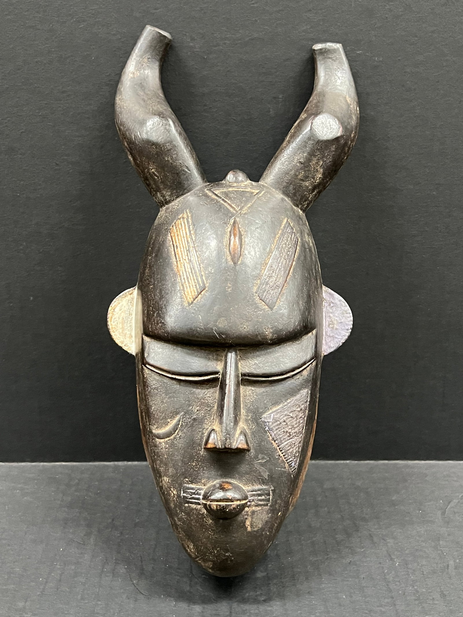 Carved Wood Jimini Mask: African Tribal Art Carved Wood Jimini Mask. The dimension is 14 inches high x 6.5 inches wide. Please be aware that some of the items are vintage, secondhand, old ages, antiques and may have a defects
