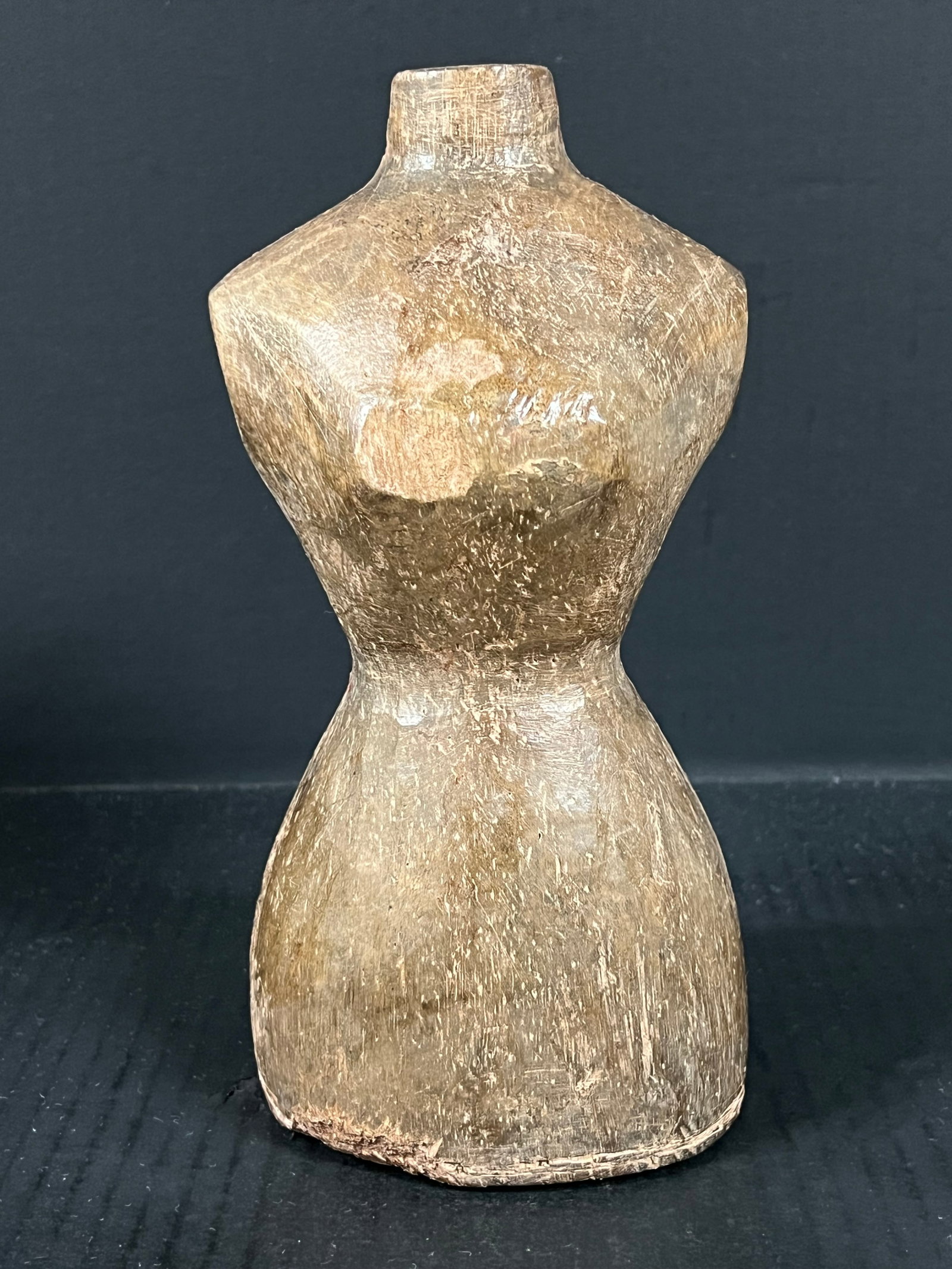 Carved Wood Mannequin - Torso: Folk Art Carved Wood Mannequin. The dimension is 9.5 inches high x 4.5 inches wide. Please be aware that some of the items are vintage, secondhand, old ages, antiques and may have a defects or sign of