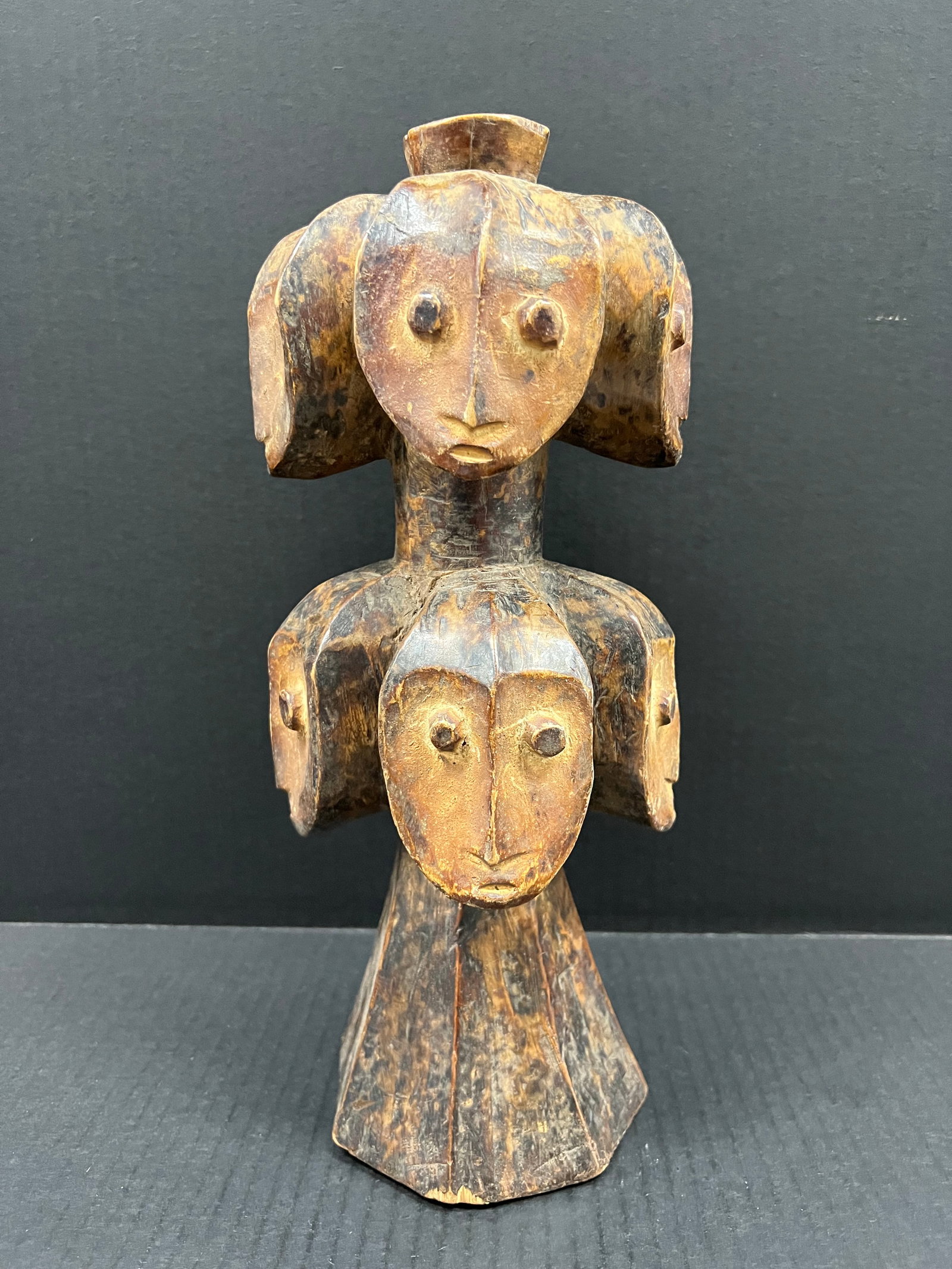 Carved Wood Lega Statue: African Tribal Art Lega Statue. The dimension is 13.5 inches high x 5.75 inches wide. Please be aware that some of the items are vintage, secondhand, old ages, antiques and may have a defects or sign