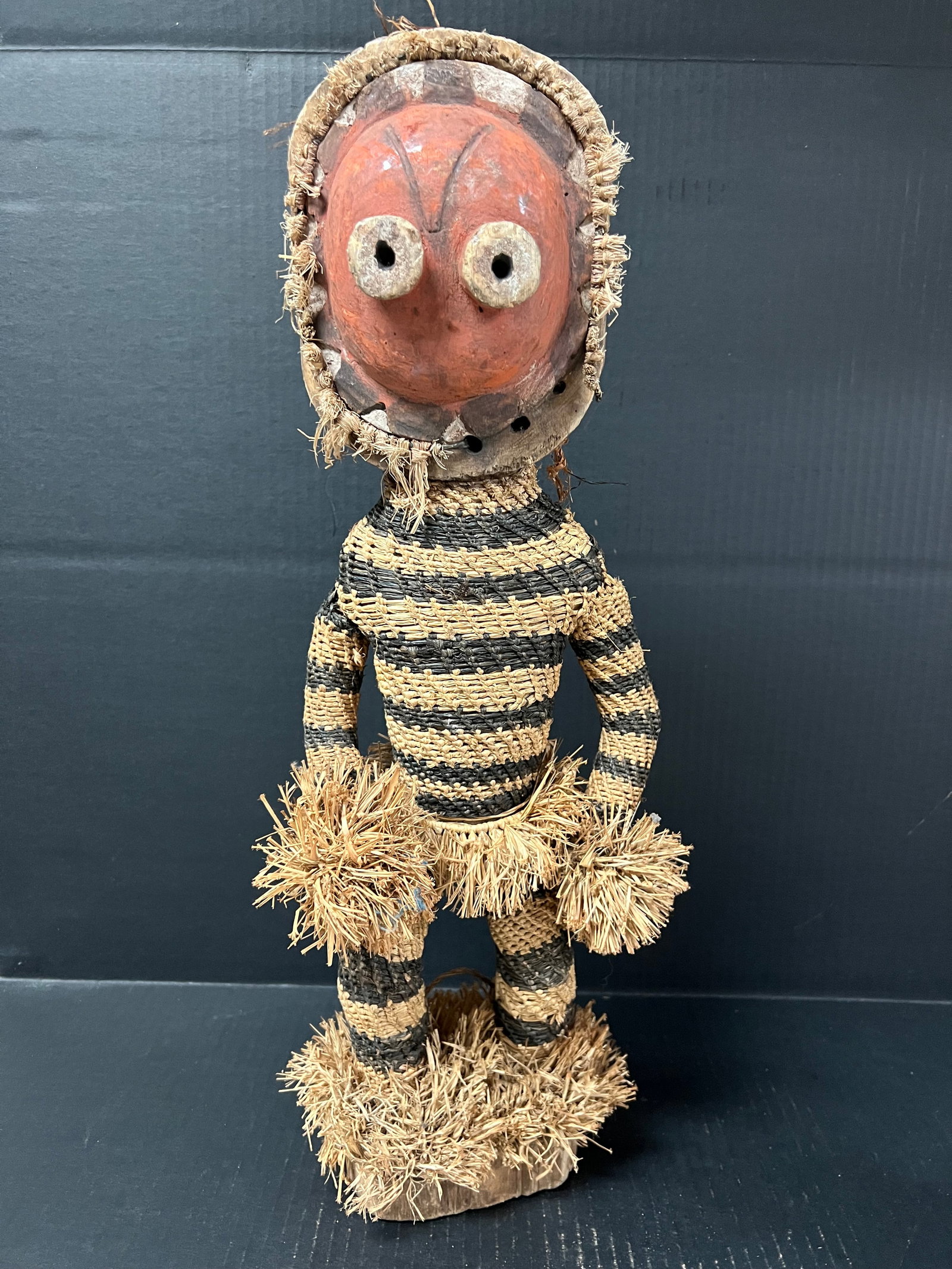 Kuba Dancer: African Tribal Art Kuba Dancer. The dimension is 21.5 inches high x 8 inches wide. Please be aware that some of the items are vintage, secondhand, old ages, antiques and may have a defects or sign of