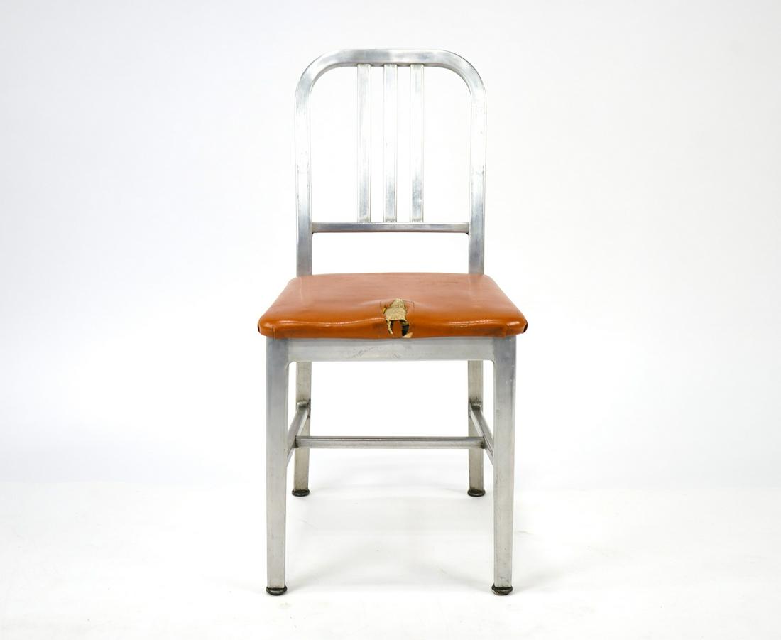 Goodform Aluminum Side Chair Good condition. Seat needs: Good condition. Seat needs repair but the chair has no structural damage. Has labels on the bottom. Measures 17" wide, 20" deep, and 33" tall.