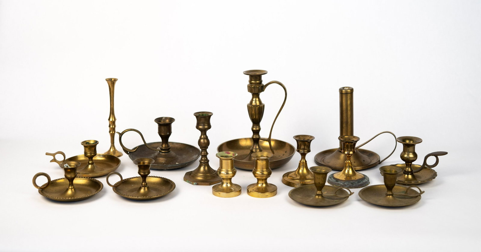 Brass Candle Holder Lot: Includes 15 candlestick holders in a variety of shapes and sizes.