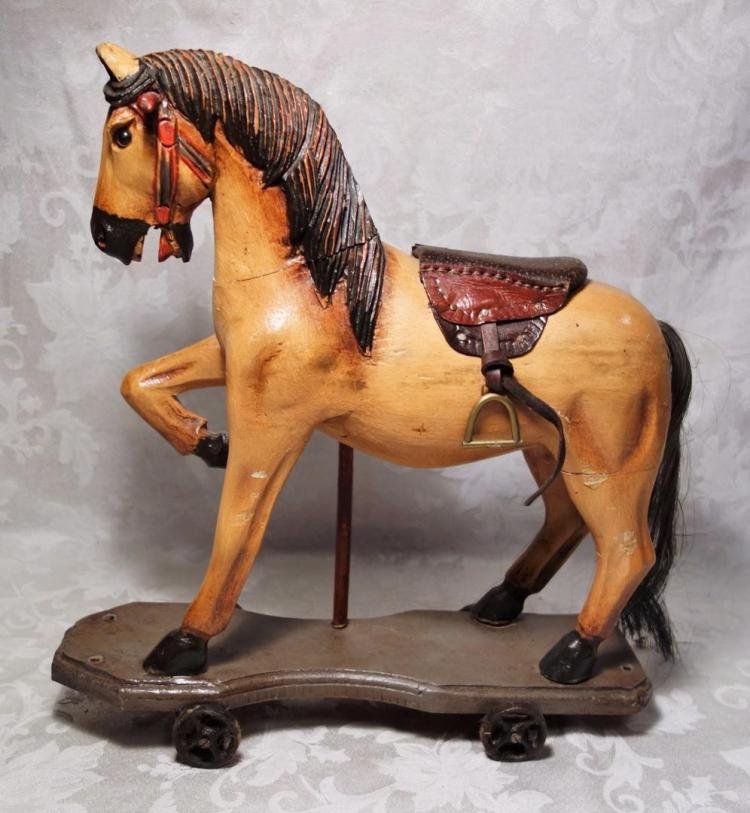 antique toy horse on wheels