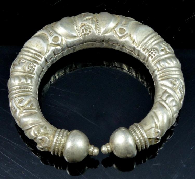 Antique Tibetan Silver Cuff Bracelet: Antique Tibetan genuine silver cuff bracelet | With beautiful repousse design | .800 or greater silver - Measures 4" (10cm) width. Total weight 69.5g. Dimensions: 4" Medium: Silver