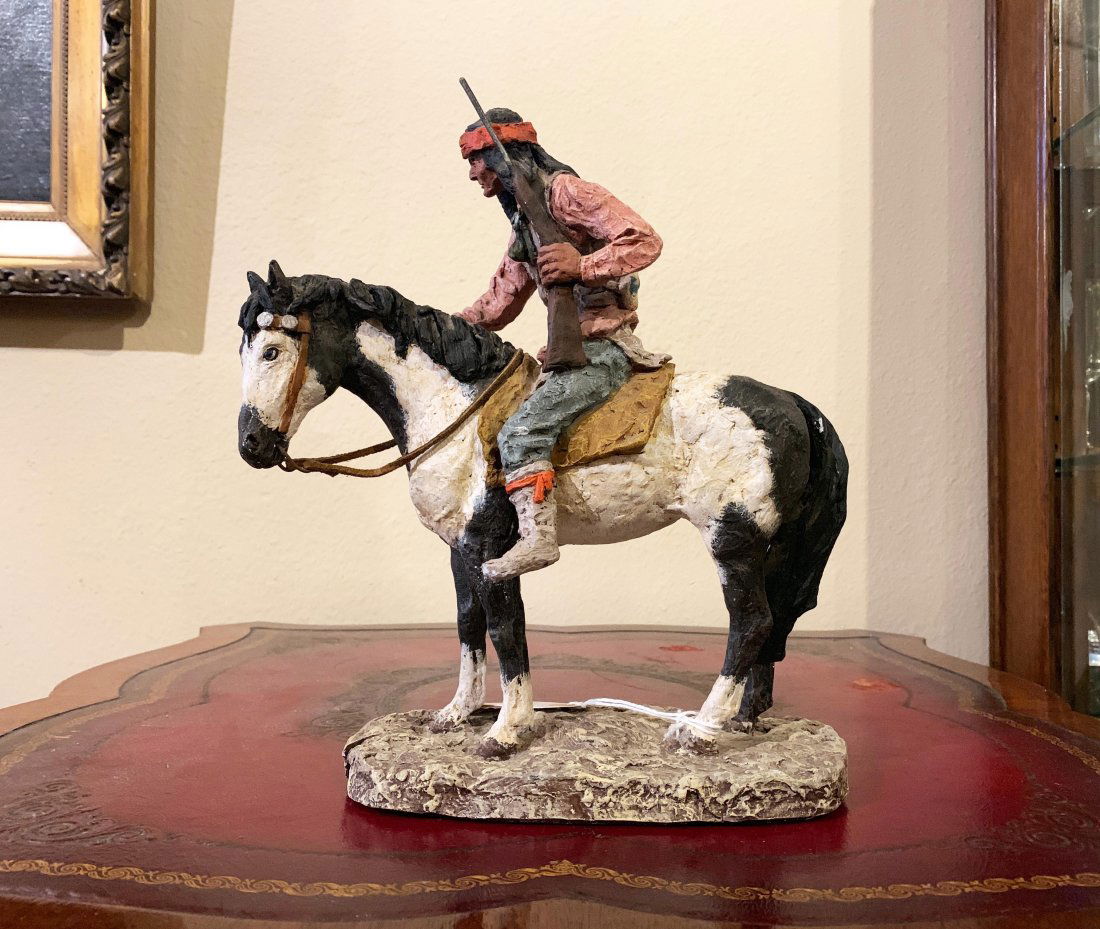 Signed Monfort Western Indian Sculpture Titled APACHE: Western Indian Warrior Sculpture by Daniel Monfort (French / American, 1942 - ) | Signed & Dated1989 | Entitled: APACHE | Depicts an Apache Warrior on a Painted Horse holding a rifle | Painted Hydrost