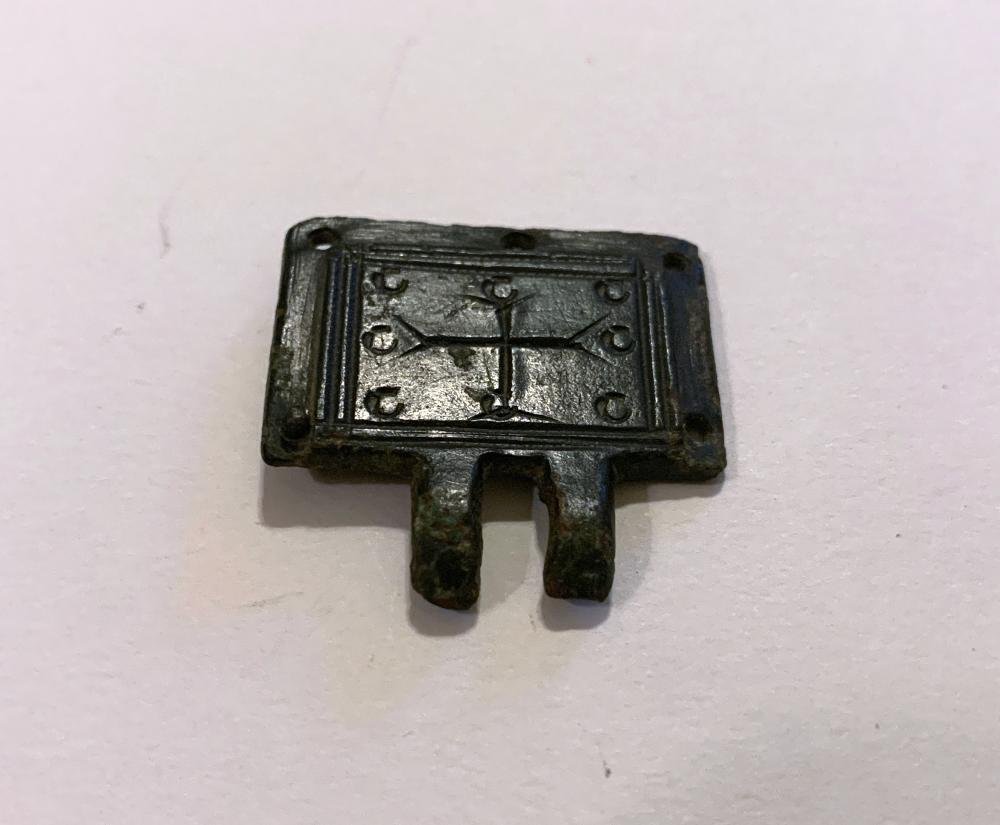 Byzantine Empire Bronze Reliquary Panel: Near East / Holy Land, Byzantine Empire, ca. 7th to 11th century AD. A cast-bronze reliquary panel decorated with a cross and pattern-molded small concentric circular forms and linear line borders | A