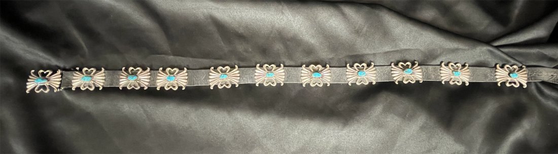 Turquoise Concho Belt by noted artist Wilson Begay: Original vintage Sand Cast Thick Heavy Gauge Sterling Belt is decorated with high relief Butterfly conchos, each featuring a turquoise stone, with the buckle matching the belt butterfly conchos. Signe