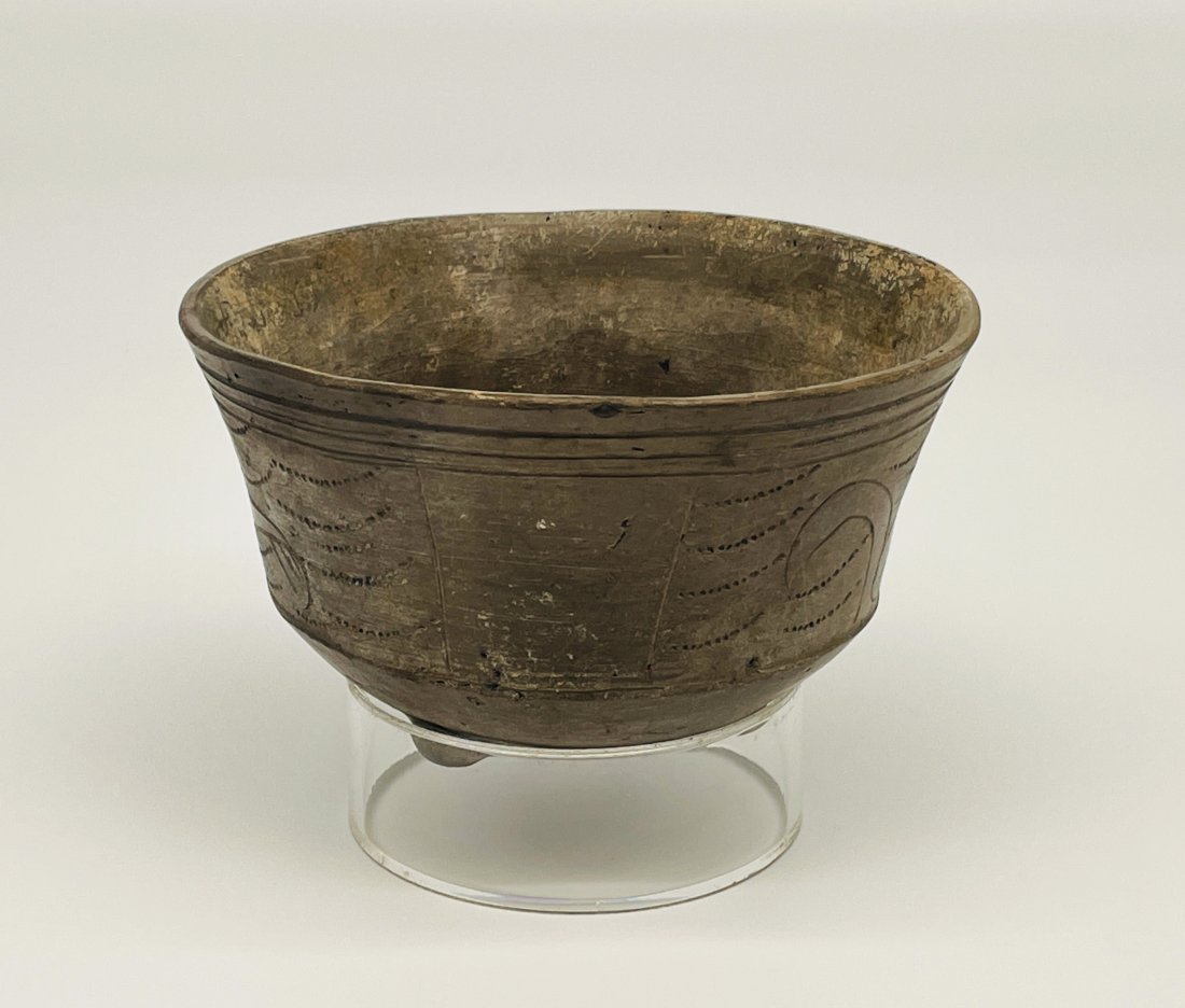 Pre-Columbian Mayan Incised Pottery Bowl: Pre-Columbian Mayan Incised Pottery Bowl with tripod feet and rare double bottom | Decorated with monkeys and geometric designed | Approx. Size: 3.5" H x 5.5" D | Provenance: The Estate of Dr. Ora & E
