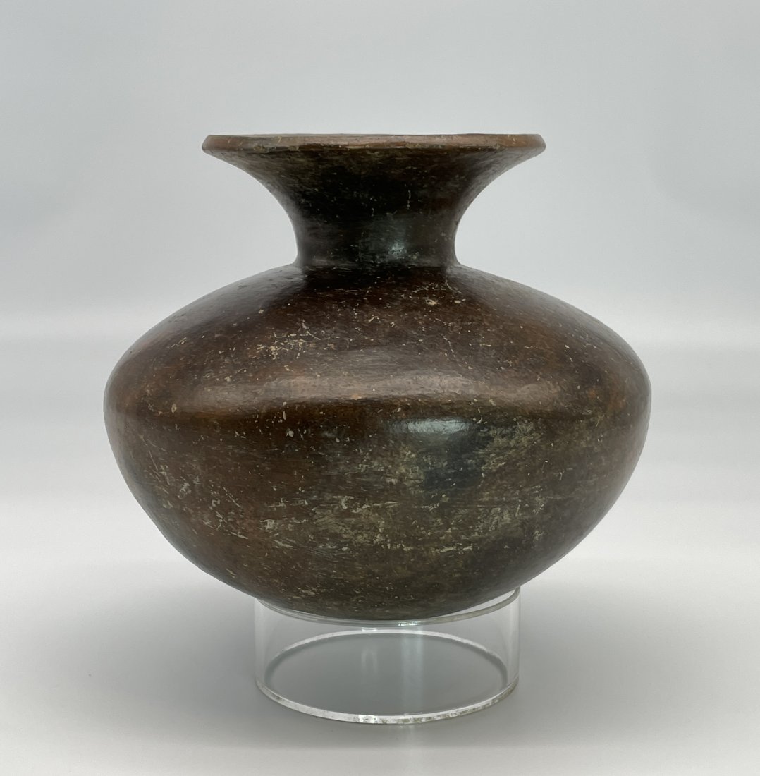 Pre-Columbian Nicoya Olla Pottery: Rare Pre-Columbian Nicoya Culture Olla Pottery Jar | A beautiful dark brown slipped jar in remarkable condition | Approx. Size: 6.5" H x 7" D.