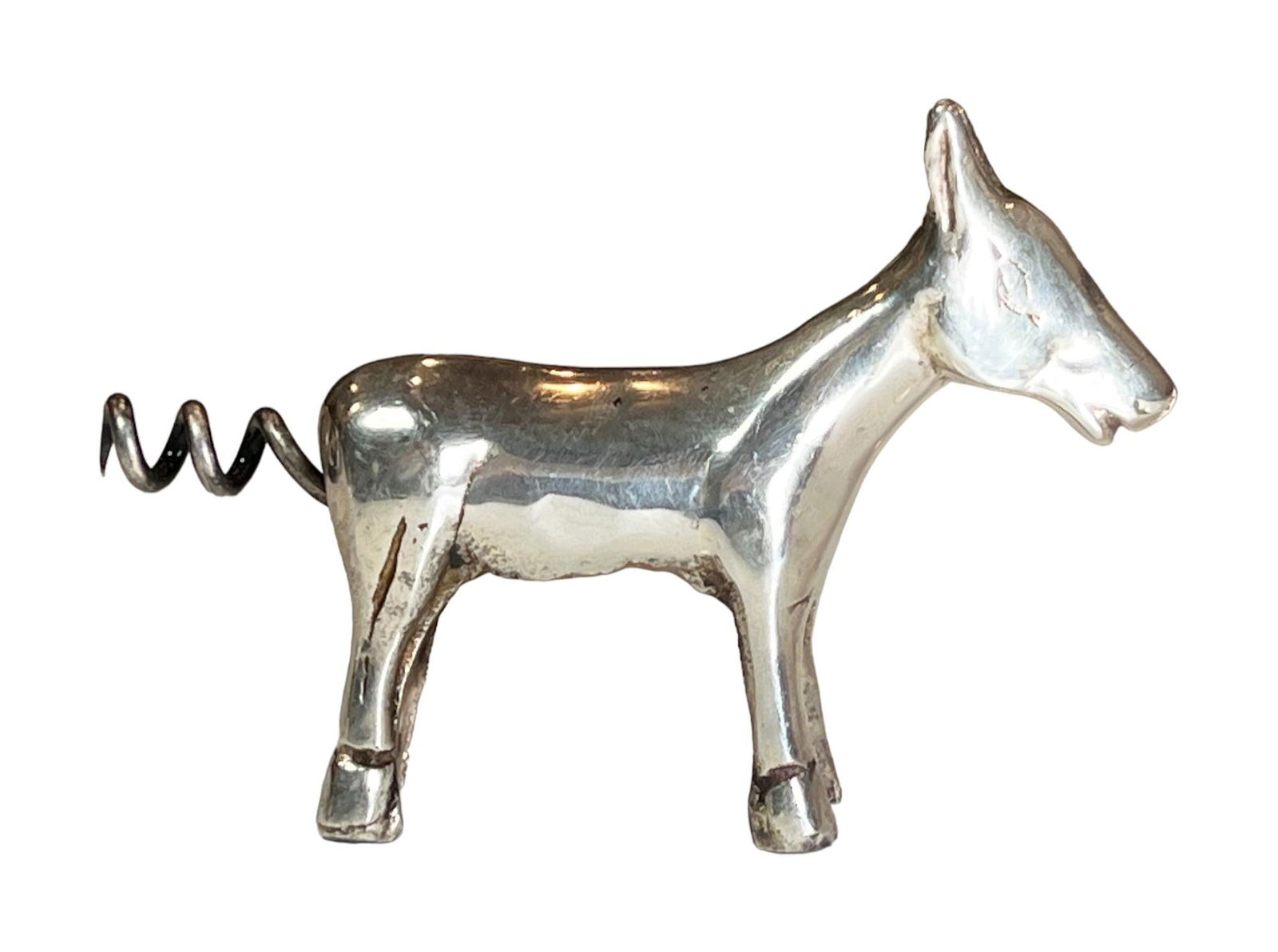 Sterling Silver Animal Shaped Wine Opener: Sterling Silver Animal Shaped Wine Opener - Appears to be equine figure (horse, mule or donkey) with the worm / screw as its tail. The worm / screw pulls out for use. Marked Sterling. Approx. Size: 4"