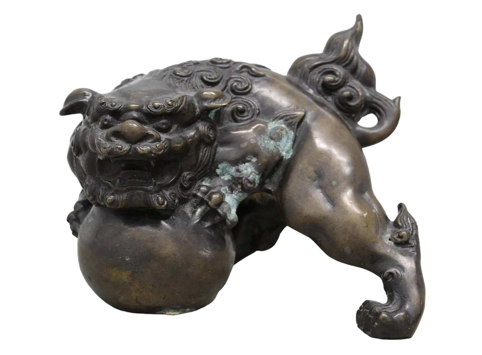 Large Archaic Chinese Bronze Male Guardian Lion / Foo Dog: Heavy Archaic Chinese Solid Bronze Male Guardian Lion / Foo Dog. This Crouching Fierce Lion has an open mouth and is holding with heavy clawed paws a ball / globe. Has a menacing visage to deter anyon