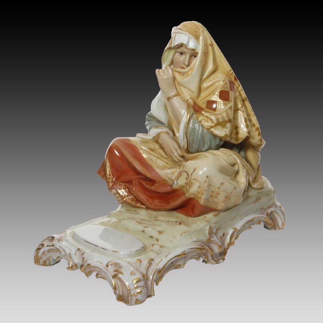 KPM Polychrome Figure of Woman in Arab Costume: KPM Polychrome figure of woman sitting in traditional Arab costume. Polychromed multi colored with raised gold highlights. Marked KPM 3587/15.; Circa: 20th century. Origin: Germany; Dimensions: 8.0"H