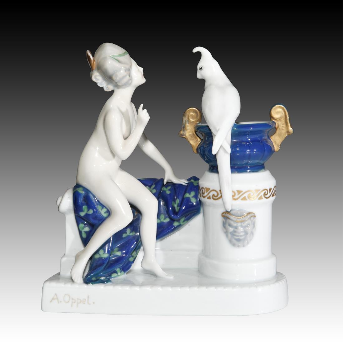 Rosenthal Figurine Nude Venus with Parrot: Rosenthal Figurine Nude Venus with Parrot Rosenthal figurine Nude Venus with Parrot perched on a jardiniere and pedestal. She is sitting on a blue blanket with a green patterns. Designer: A. Oppel Ori