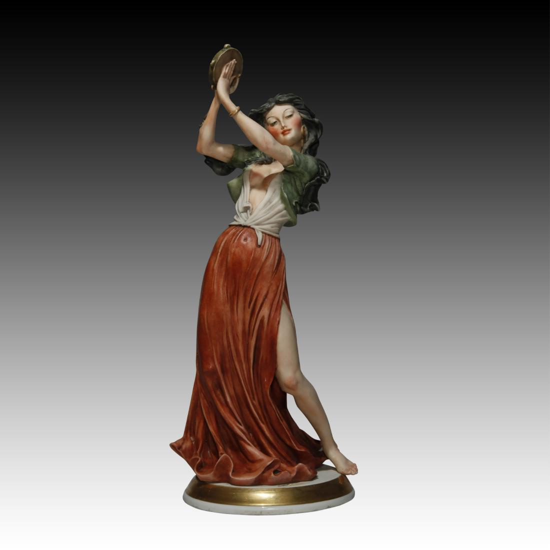 Capodimonte Figurine of a Gypsy Girl: Capodimonte Figurine of a Gypsy Girl Capodimonte Figurine of a Gypsy Girl playing the tambourine. Origin: Italy Size: 14.0" H Issued: 20th century