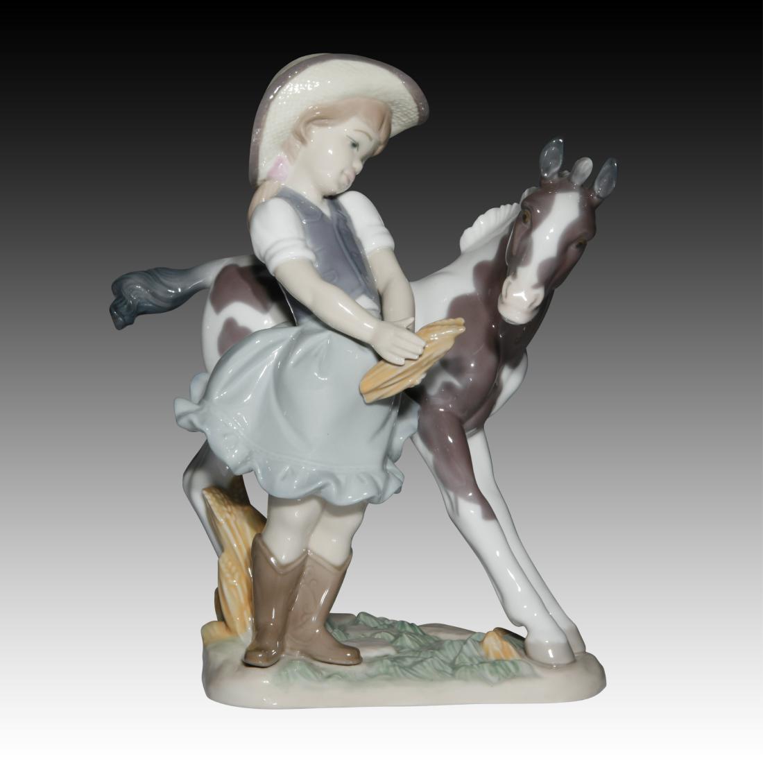 Lladro "Cowgirl" Figurine 01008636: Lladro "Cowgirl" Figurine 01008636 Lladro porcelain figurine of a young girl wearing a cowboy hat and boots standing next to her pony. Origin: Spain Size: 9.0" H Issued: 20th century