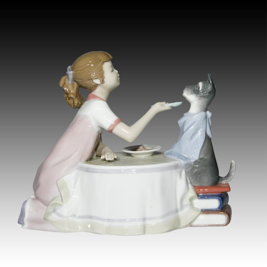 Lladro "Tea Time" # 9197 Figurine: Lladro "Tea Time" # 9197 Figurine Lladro Figurine called "Tea Time" #9197. Young Girl feeding her Dog at the table with a spoon. NO BOX. Designer: Francisco Polope Origin: Spain Size: 6.5"H Issued: 20