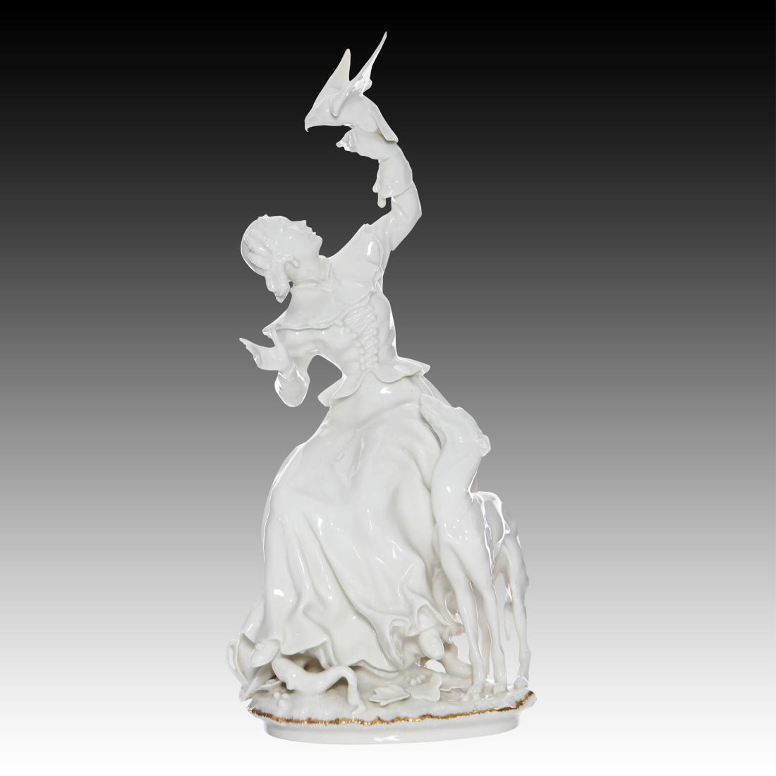 Hutschenreuther Woman Falconer with Greyhound: Hutschenreuther Woman Falconer with Greyhound Chine de Blanc figurine of a young Woman with her Falcon landing on her gloved hand. Her Greyhound Dog is at her side. The base has gold gilt around the e