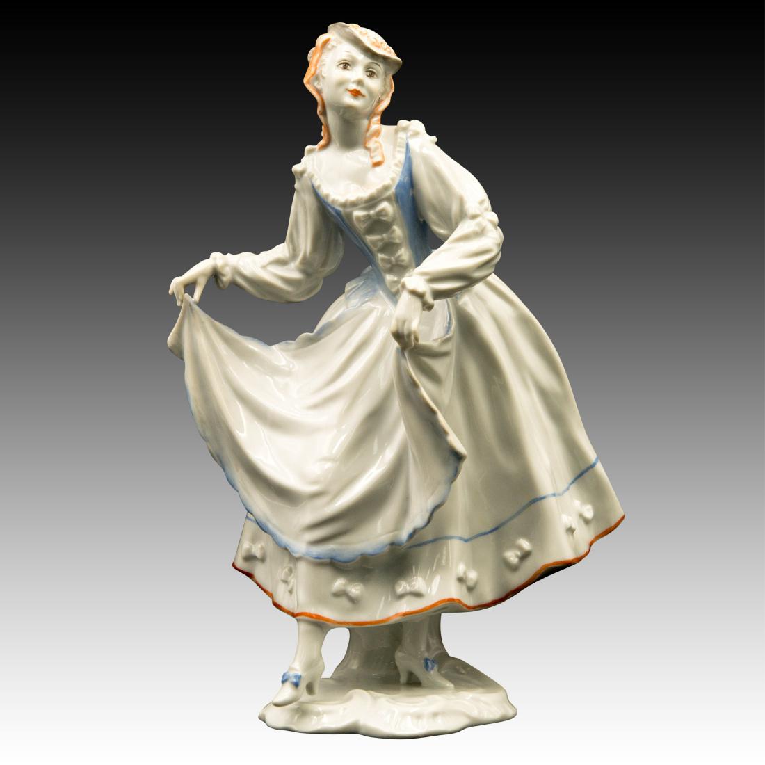 Rosenthal Rococo Lady Dancer Figurine: Rosenthal Rococo Lady Dancer Figurine Rosenthal Rococo Lady Dancing in a light pastel blue gown with orange trim. Origin: Germany Size: 9.75"H Issued: 20th Century