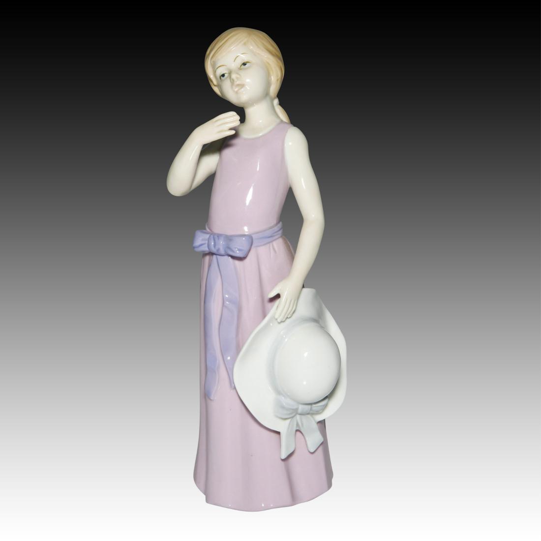 KPM Girl with the Lavender Dress Figurine: KPM Girl with the Lavender Dress Figurine KPM Girl with the Lavender Dress Figurine holding a white wide-brimmed hat. Origin: Germany Size: 10.0" H Issued: 20th Century