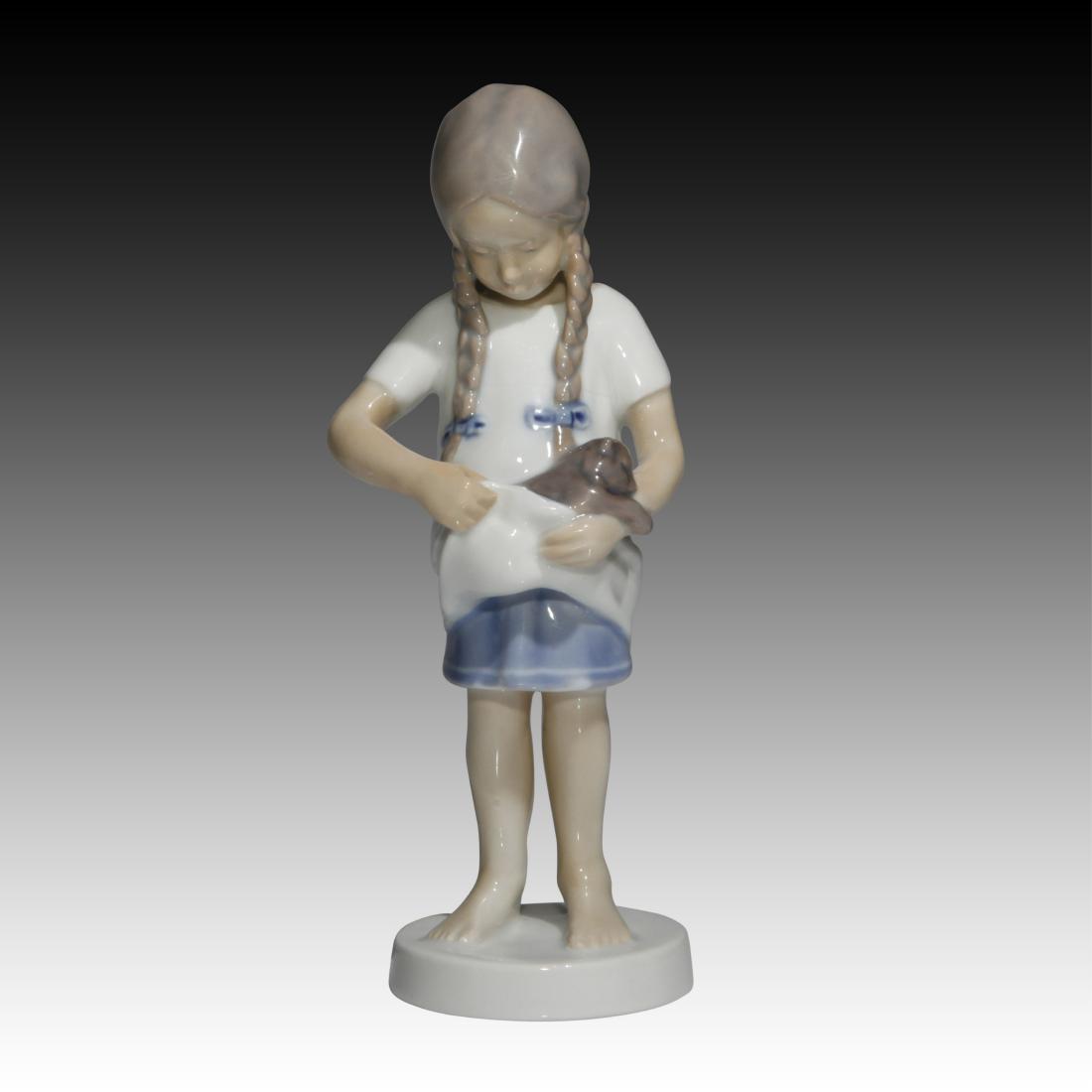 Bing & Grondahl Young Girl with Kitten Figurine: Bing & Grondahl Young Girl with Kitten Figurine Bing & Grondahl figurine of a Young Girl holding a Kitten in her arms. Model # 1779. Origin: Denmark Size: 7.0"H Issued: 20th Century