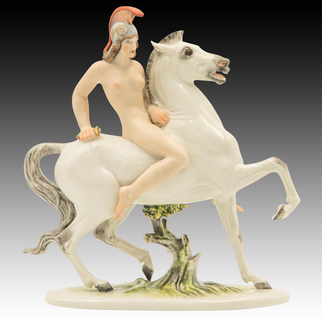 Nude Grecian Woman on Horseback Figurine: Nude Grecian Woman on Horseback Figurine Efchenbach Nude Grecian Woman riding a White Horse with a sword in her right arm. The sword blade is missing. Model # K43z Designer: T Karner Origin: Germany S