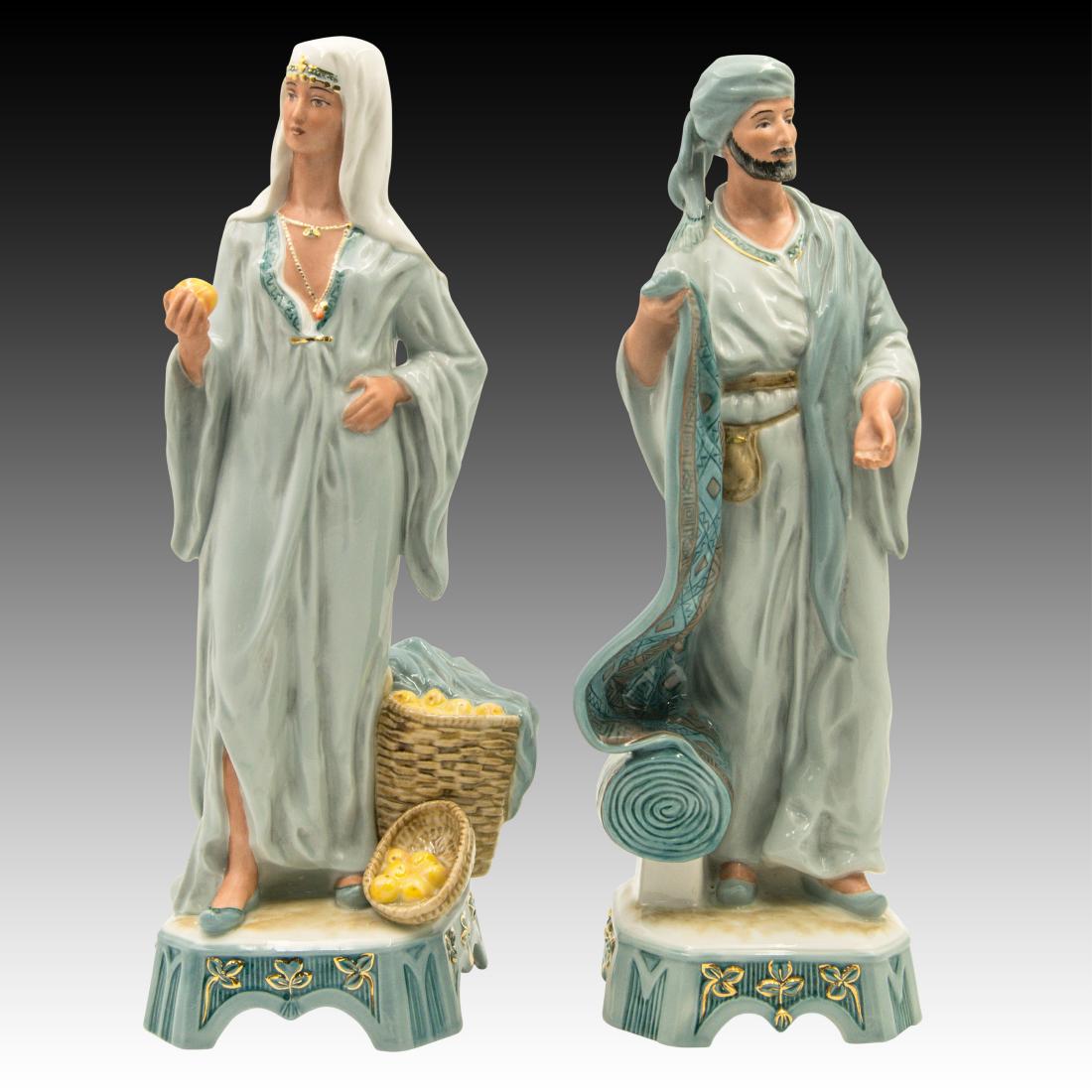 Royal Dux Middle Eastern Street Vendors Figurines: Royal Dux Middle Eastern Street Vendors Figurines A pair of middle eastern street vendors. The woman 10380 is a fruit seller and the man is a 10379 is a carpet seller. Origin: Bohemia Size: 13.0" & 13
