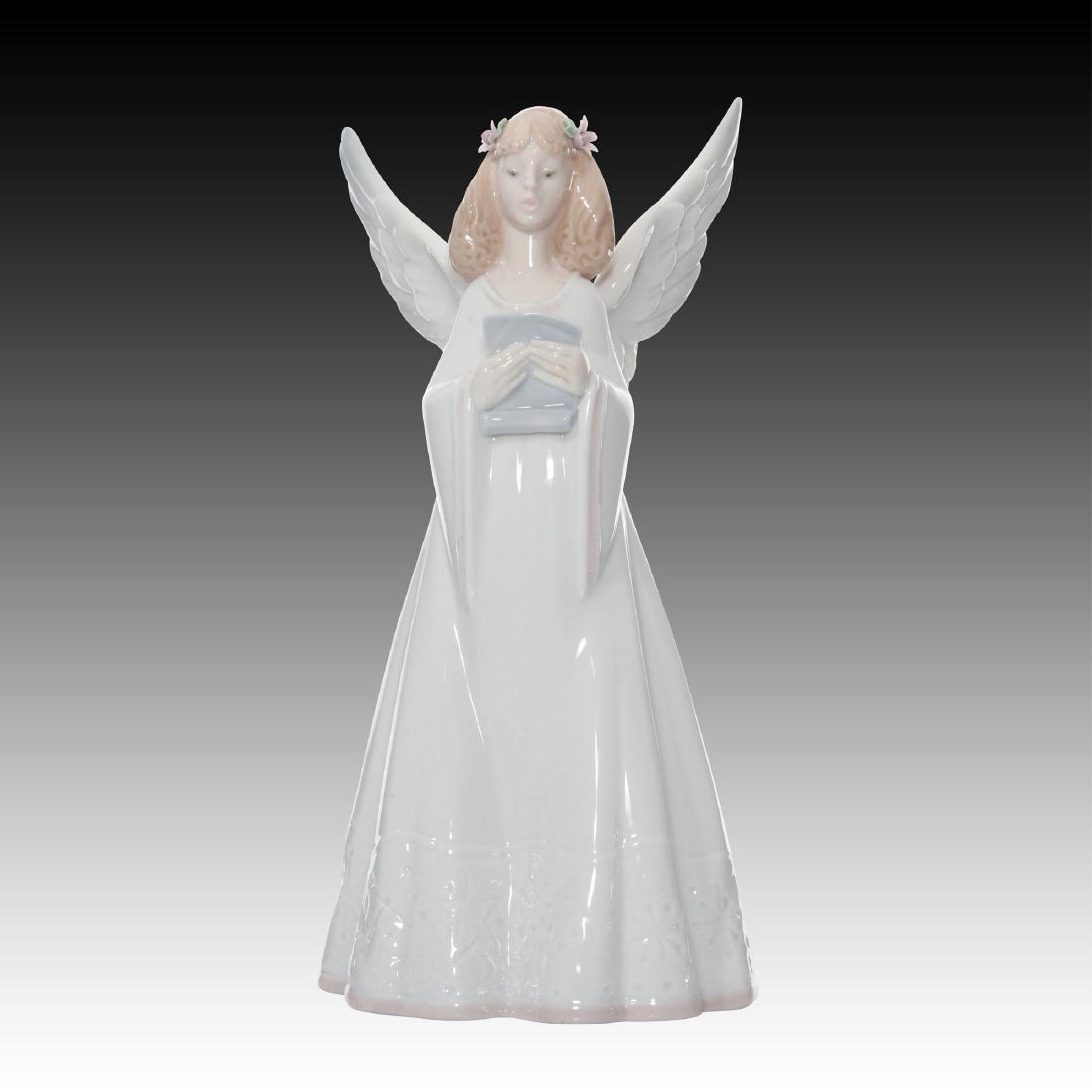 Lladro Rejoice Figurine 6321 Retired 1997: Spanish Name: Angel Cantor Sculptor: Design & Decoration Dept. Year Issued: 1996 Year Retired: 1997 Finish: Glazed Height (in): 8.25 ; Country of Origin: Spain;