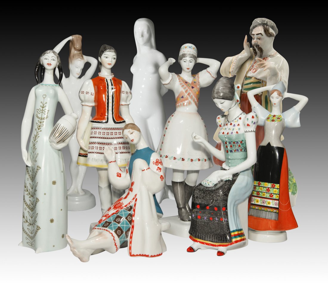 Group of 9 Aquincum, Royal Dux, Hollohaza: Group of 9 Aquincum, Royal Dux, Hollohaza Figurines Aquicum nude woman figurine Playing with her hair Budapest 10.5" H Seated blue with red dress - condition excellent. Made in USSR 7" Ukranian Kozak 
