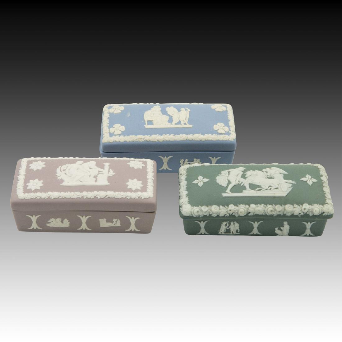 3 Rectangular Wedgwood Jasperware boxes: in Various Colors 1 in traditional light blue, 1 in green, and 1 in mauve. All are marked "Wedgwood Made in England". ; Size: 3"x3.25";