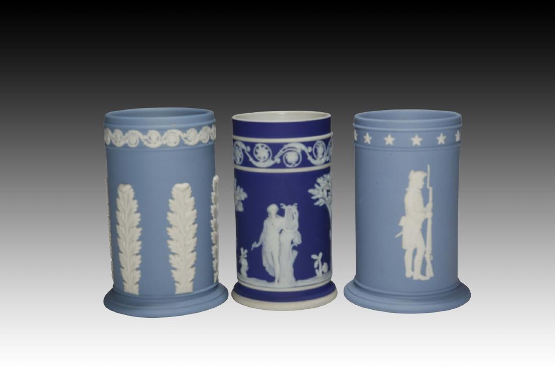 3 Cylindrical Wedgwood Jasperware Tall Vases: The 2 traditional blue spill vases are marked "Wedgwood Made in England" and also have :" The Wedgwood Collectors society" mark. The rarer dark blue spill vase is marked :"Wedgwood Made in England", w