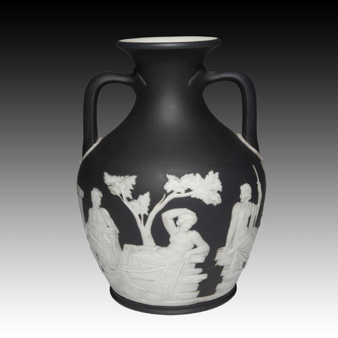 Wedgwood Black Jasper Portland Vase: ca 19th century. with applied figures in white along the lower body depicting the myth of Peleus and Thetis. The vase is marked:"Wedgwood England". This portland vase is Josiah Wedgwoods signature pie