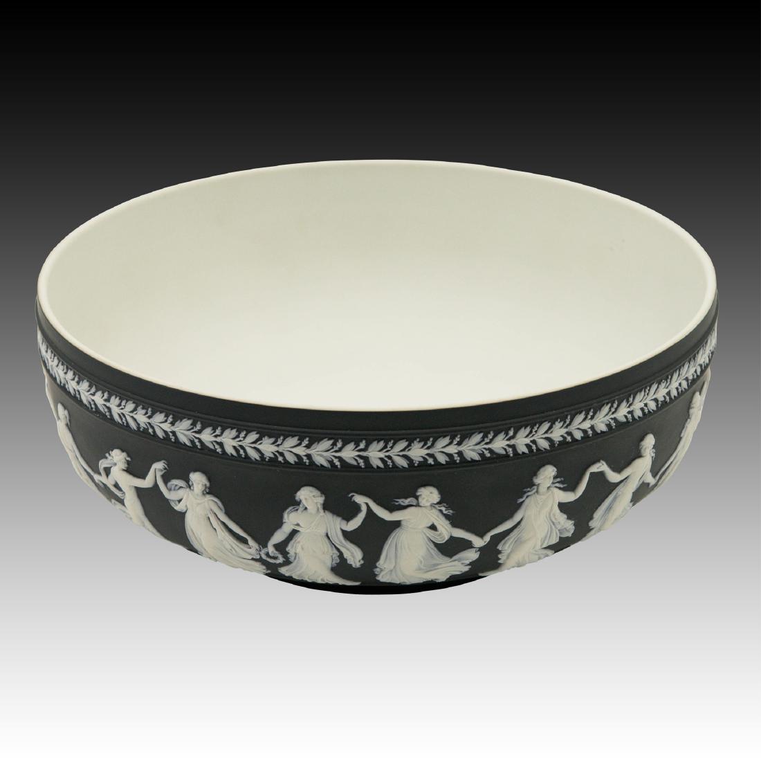 Large Wedgwood Black Jasperware Bowl: This bowl is in excellent condition depicting the dancing hours with excellent details. Marked "Wedgwood Made in England". A stunning addition to any collection. ; Size: 10"D;